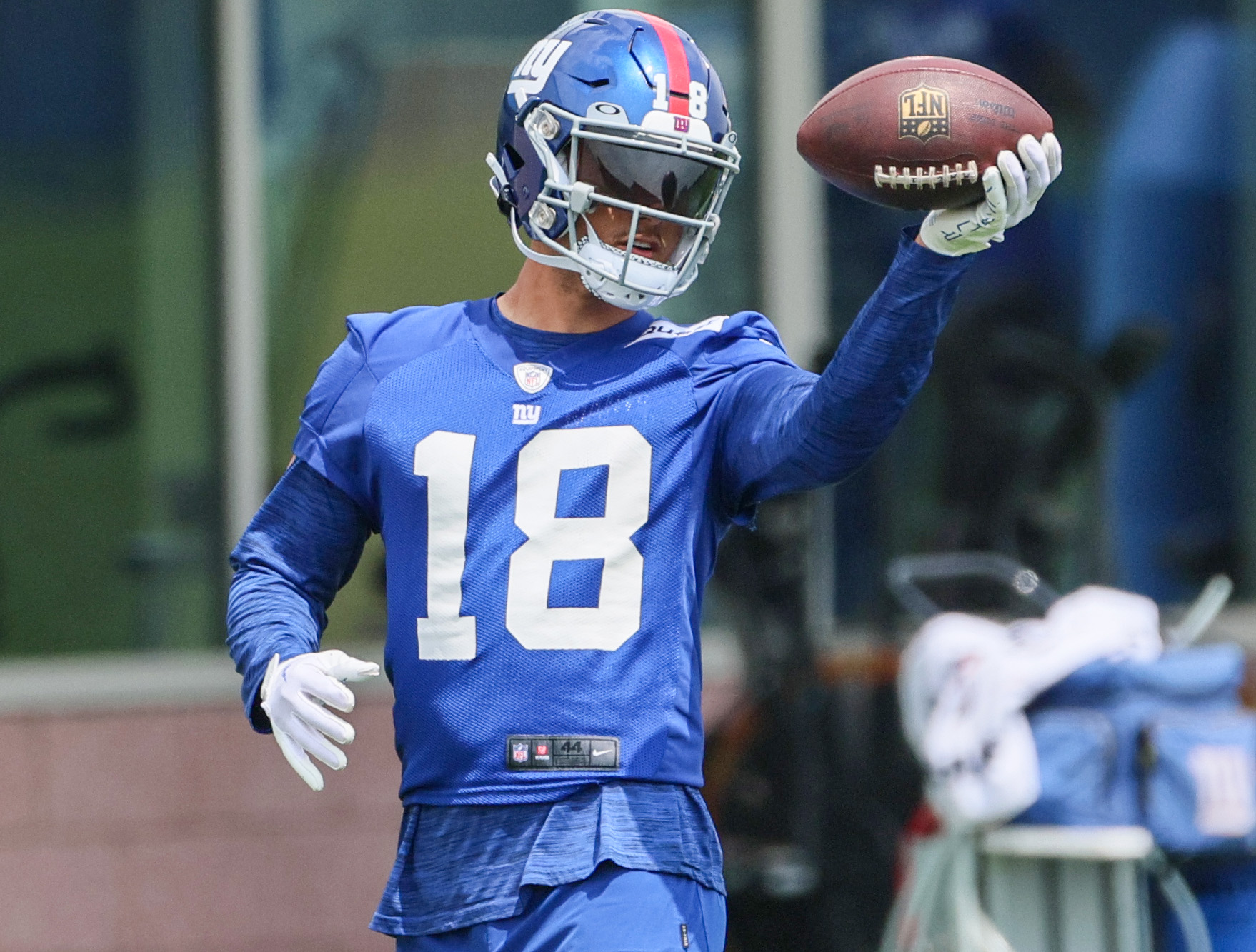 New York Giants wide receiver Isaiah Hodgins (18) runs with the ball  against the Washington Commanders during an NFL football game Sunday, Dec.  4, 2022, in East Rutherford, N.J. (AP Photo/Adam Hunger