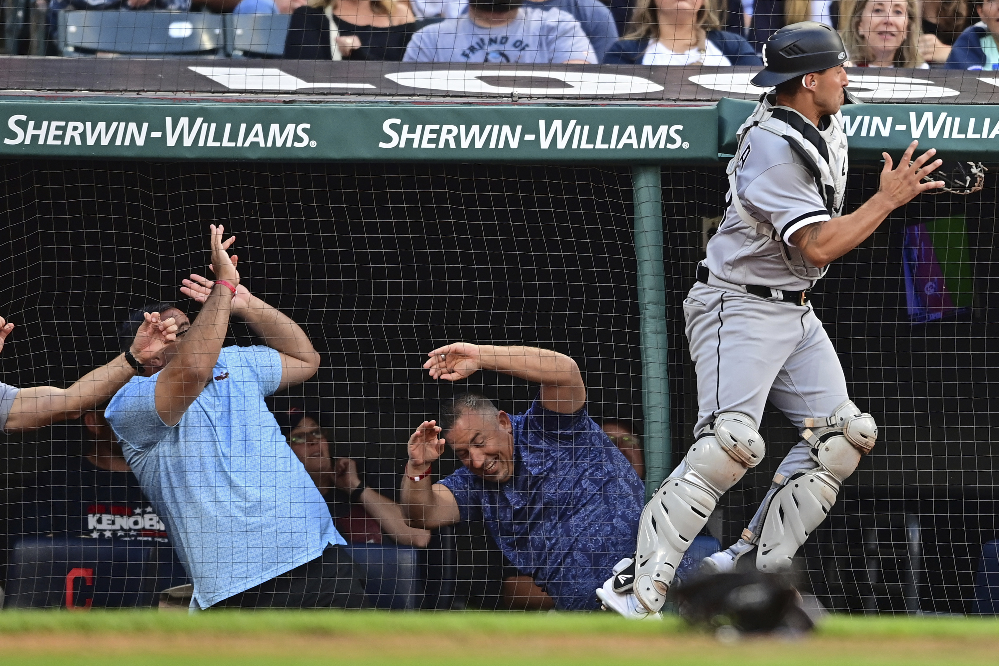 Chicago White Sox left fielder Eloy Jimenez, right, is congratulated by  center fielder Luis Robert after catching a fly ball hit by Cleveland  Guardians' Jose Ramirez during the sixth inning of a