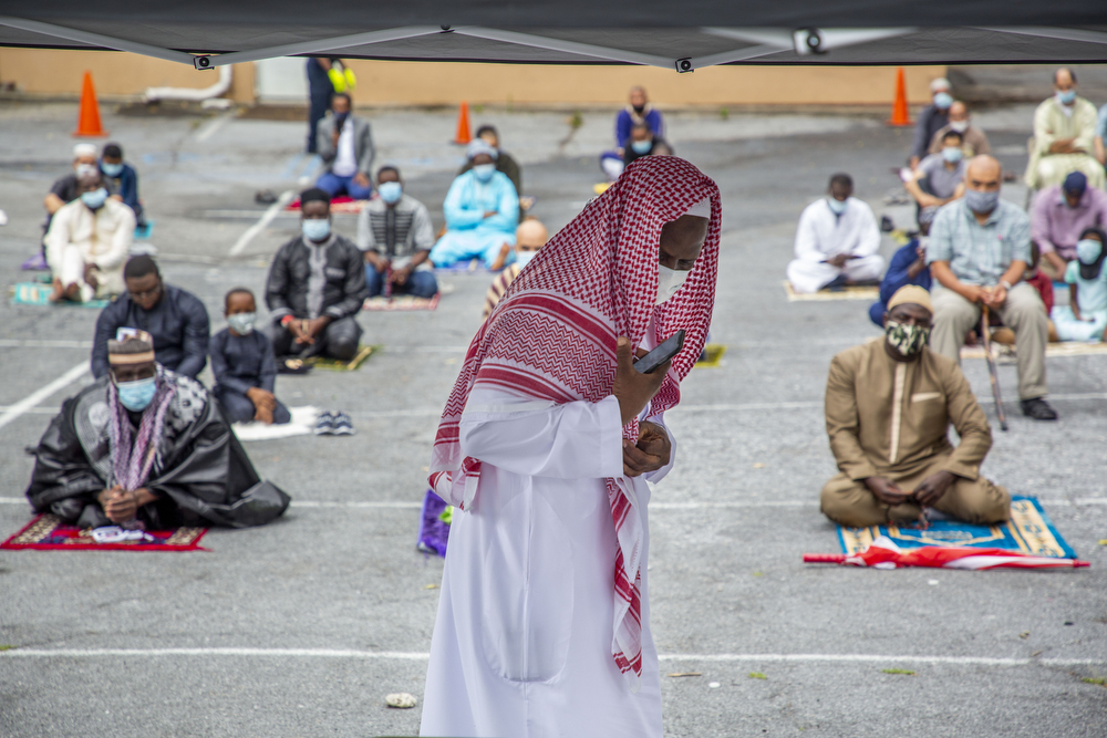 Shaik Osman Kaba leads prayer in Arabic and English in the parking lot of the Islamic Center Masjid Al-Sabereen in Harrisburg, Pa. during observance of the Eid Al-Adha muslim holiday, July 31, 2020.
Mark Pynes | mpynes@pennlive.com