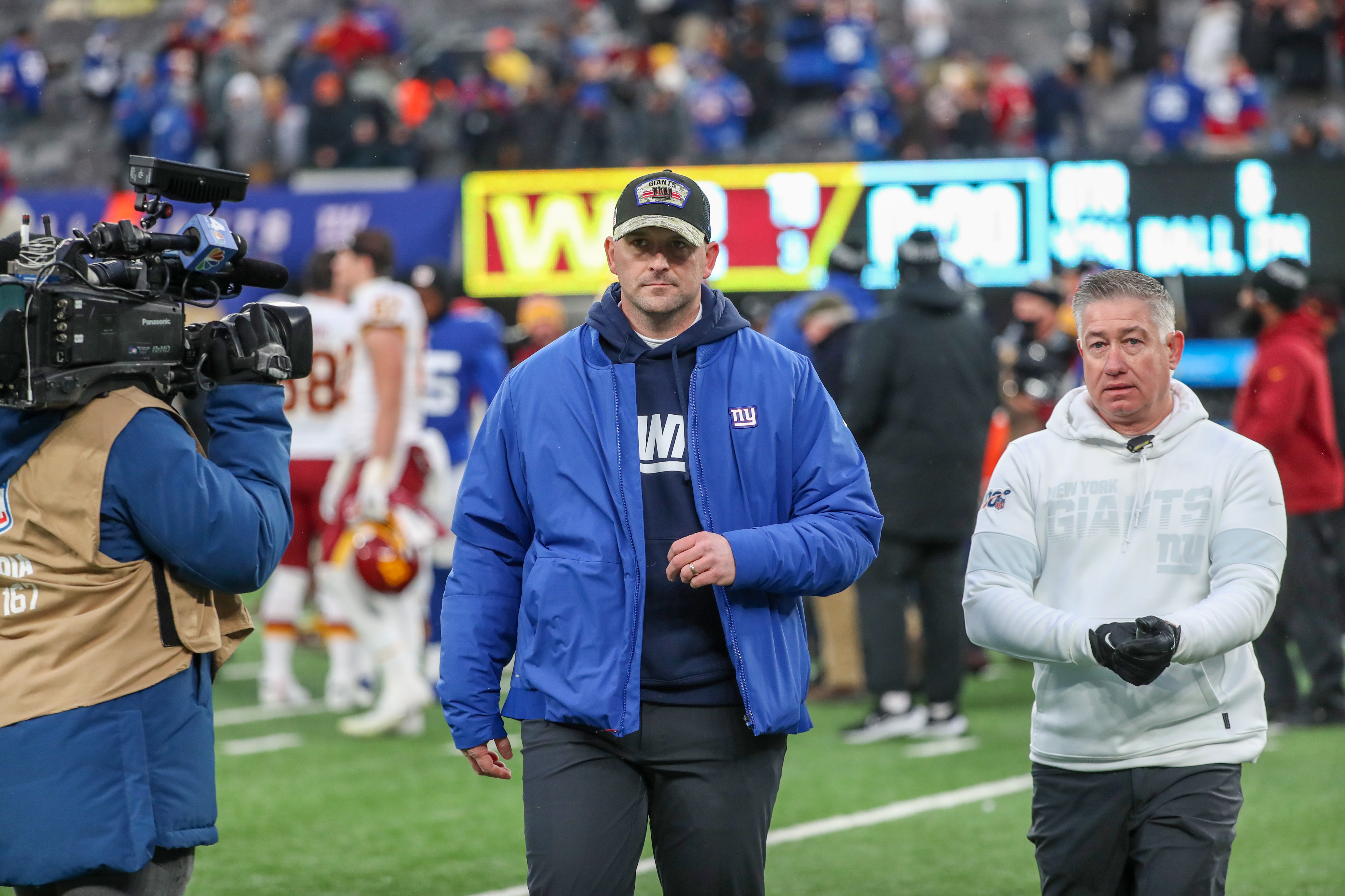 New York Giants head coach Joe Judge (center) walks off after the Giants lost to the Washington Football Team, 22-7, on Sunday, Jan. 9, 2022 in East Rutherford, N.J.