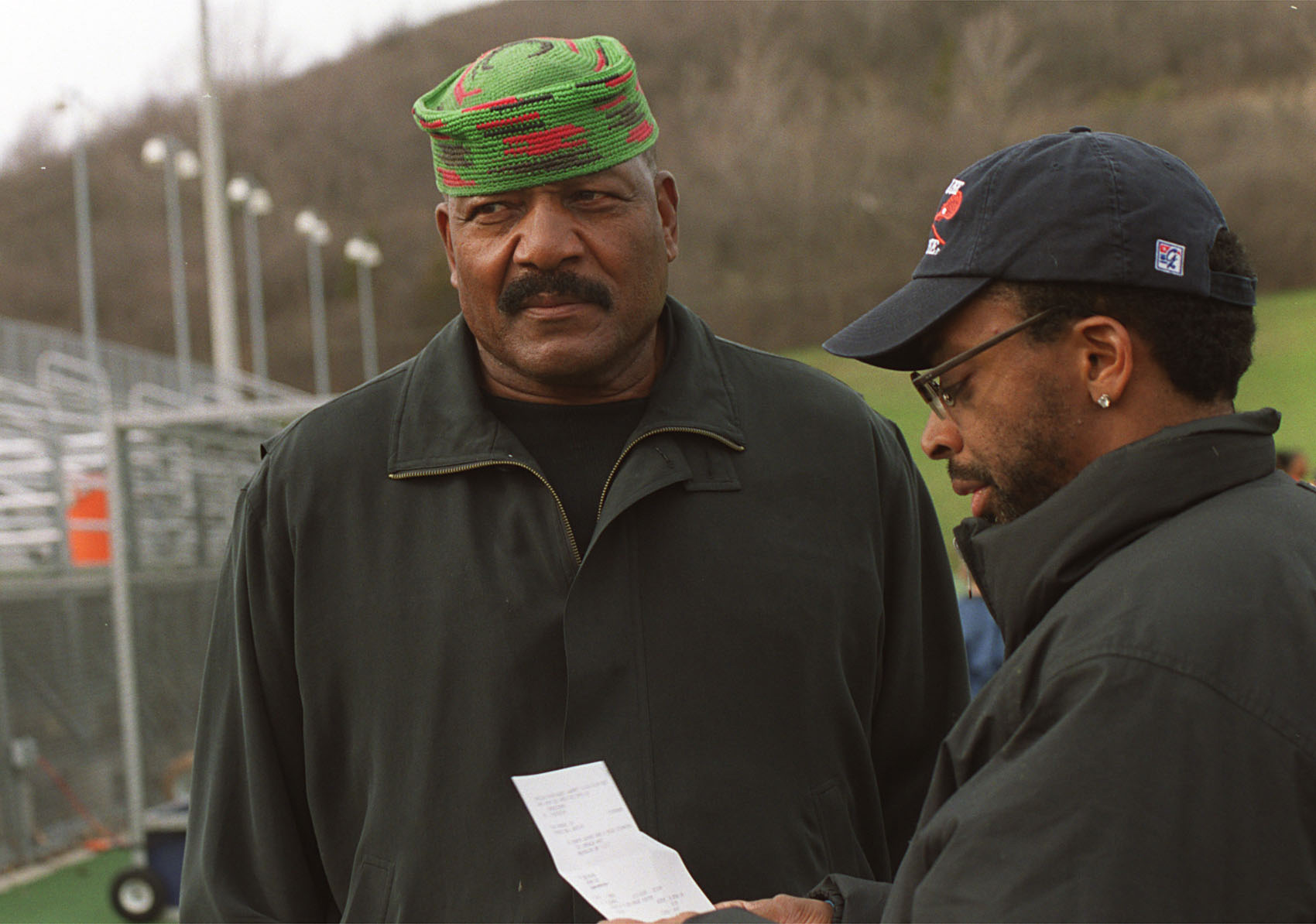 Jim Brown (l) goes over production 
notes with Spike Lee in Syracuse, N.Y. Lee was filming a documentary for HBO on the legendary NFL running back.