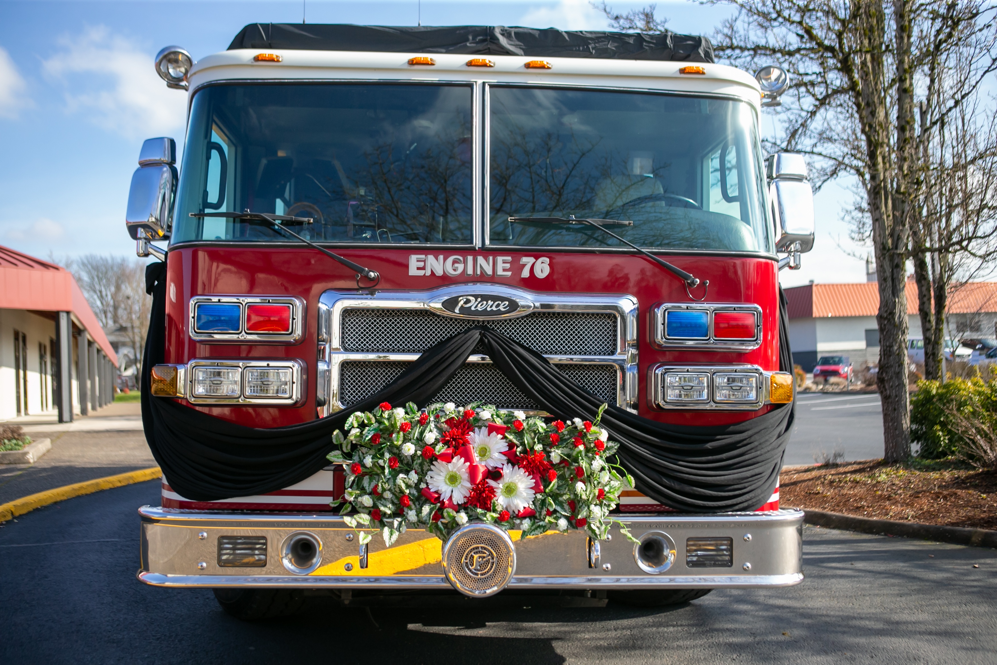 Fire engine No. 76 is adorned with flowers in honor of Gresham Firefighter Brandon Norbury in downtown Gresham, Oregon on Wednesday, Feb. 15 2023.