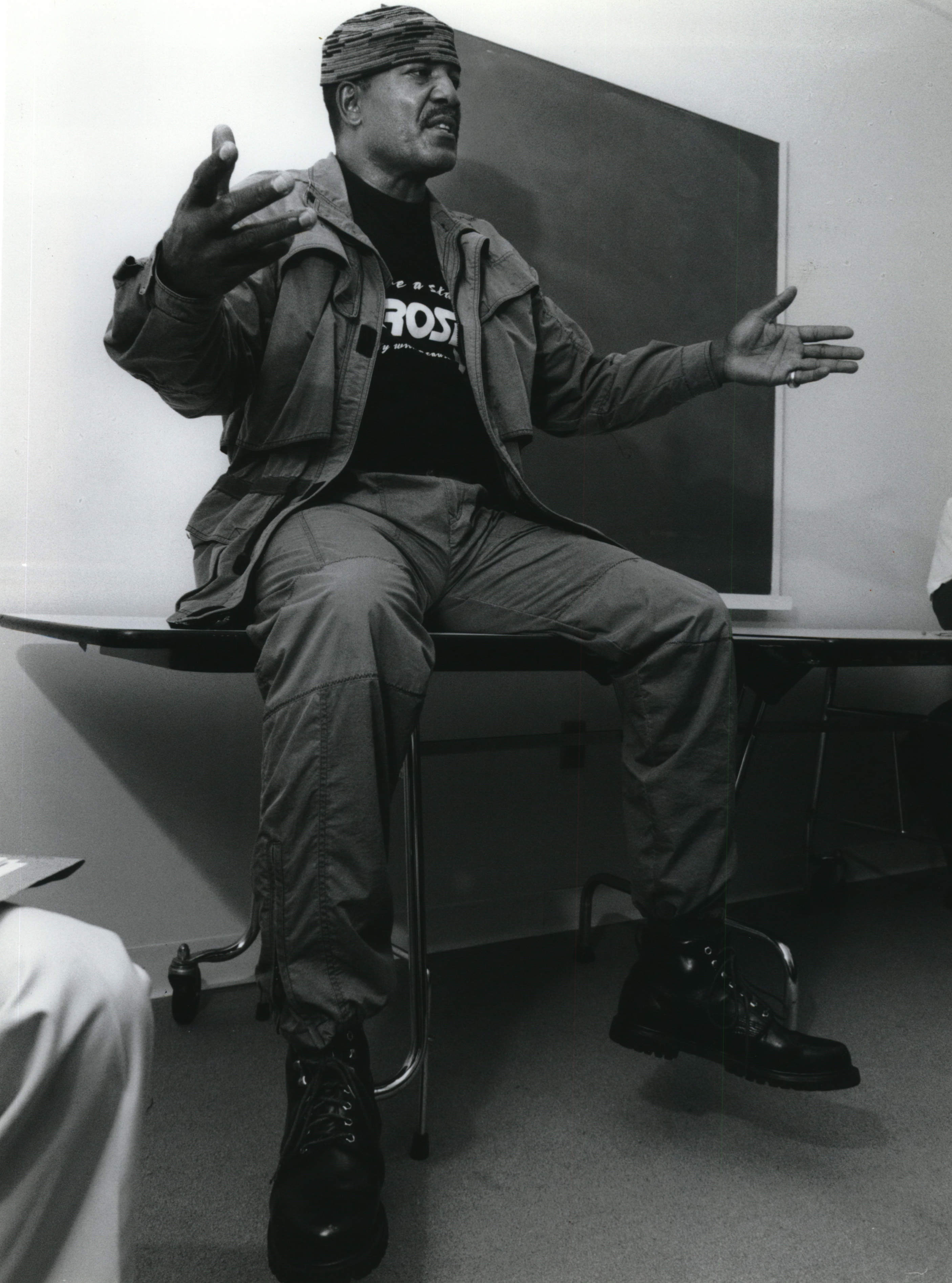 Former Syracuse University Football Player Jim Brown talking to SU students and minority alumnae in the Schine Student Center, Syracuse University, on gangs in Los Angeles that he has worked with. Photo was taken in 1992.