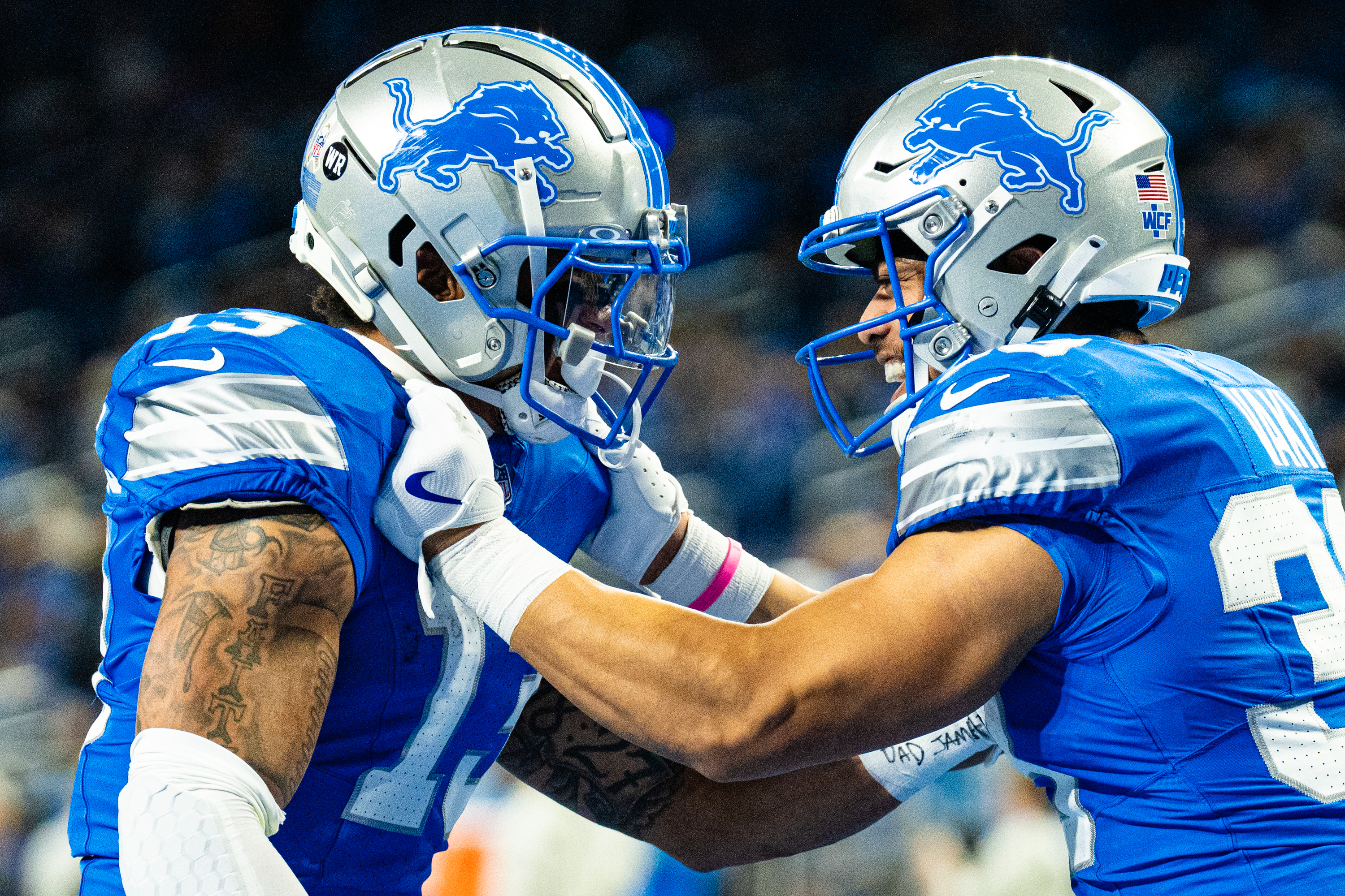 Detroit Lions running back Sione Vaki (33) and Detroit Lions running back Craig Reynolds (13) warmup during Detroit Lions vs Jacksonville Jaguars at Ford Field in Detroit on Sunday, Nov. 17, 2024. 