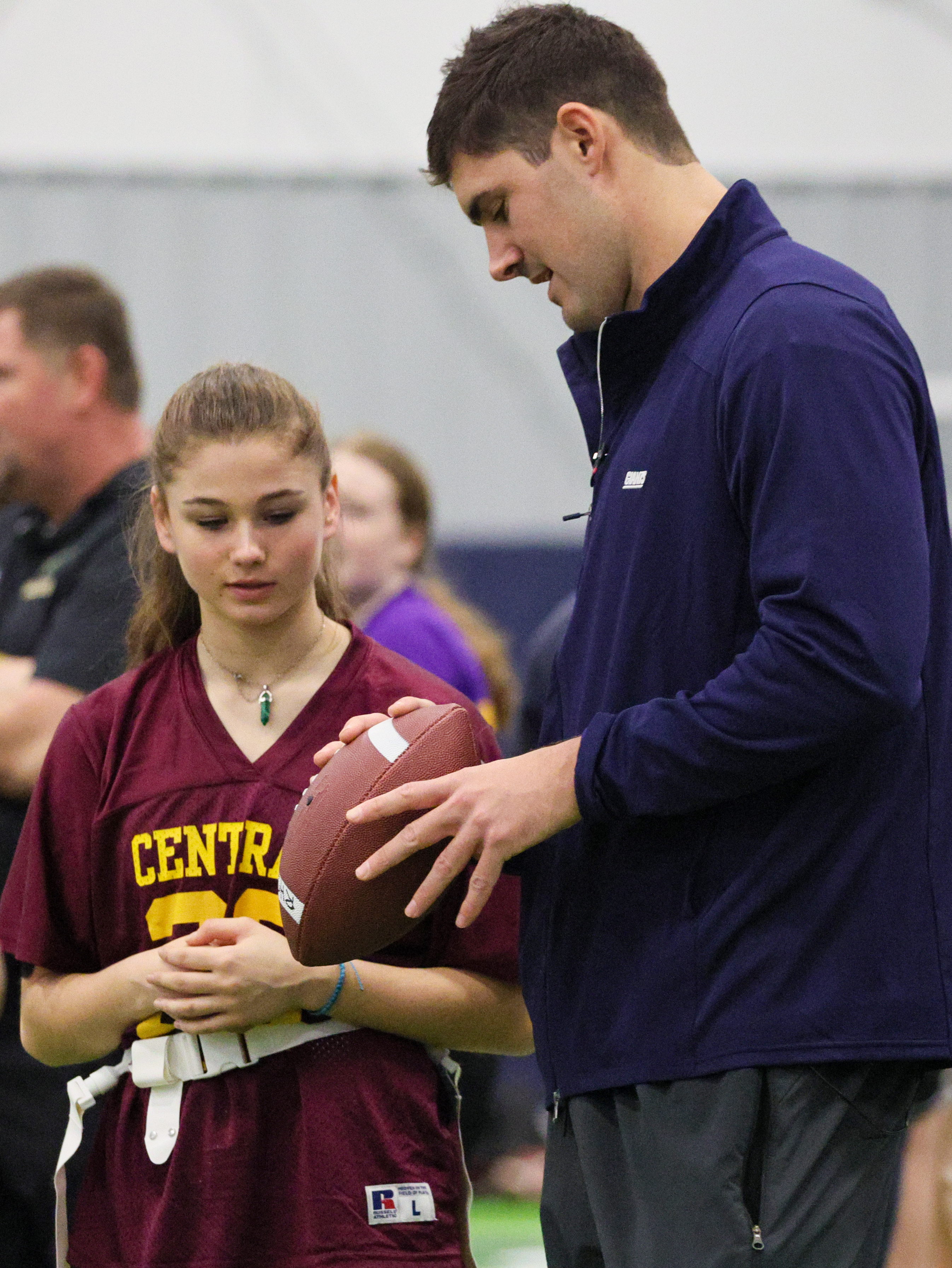 Eli Manning and Daniel Jones help with Girls Flag Football clinic