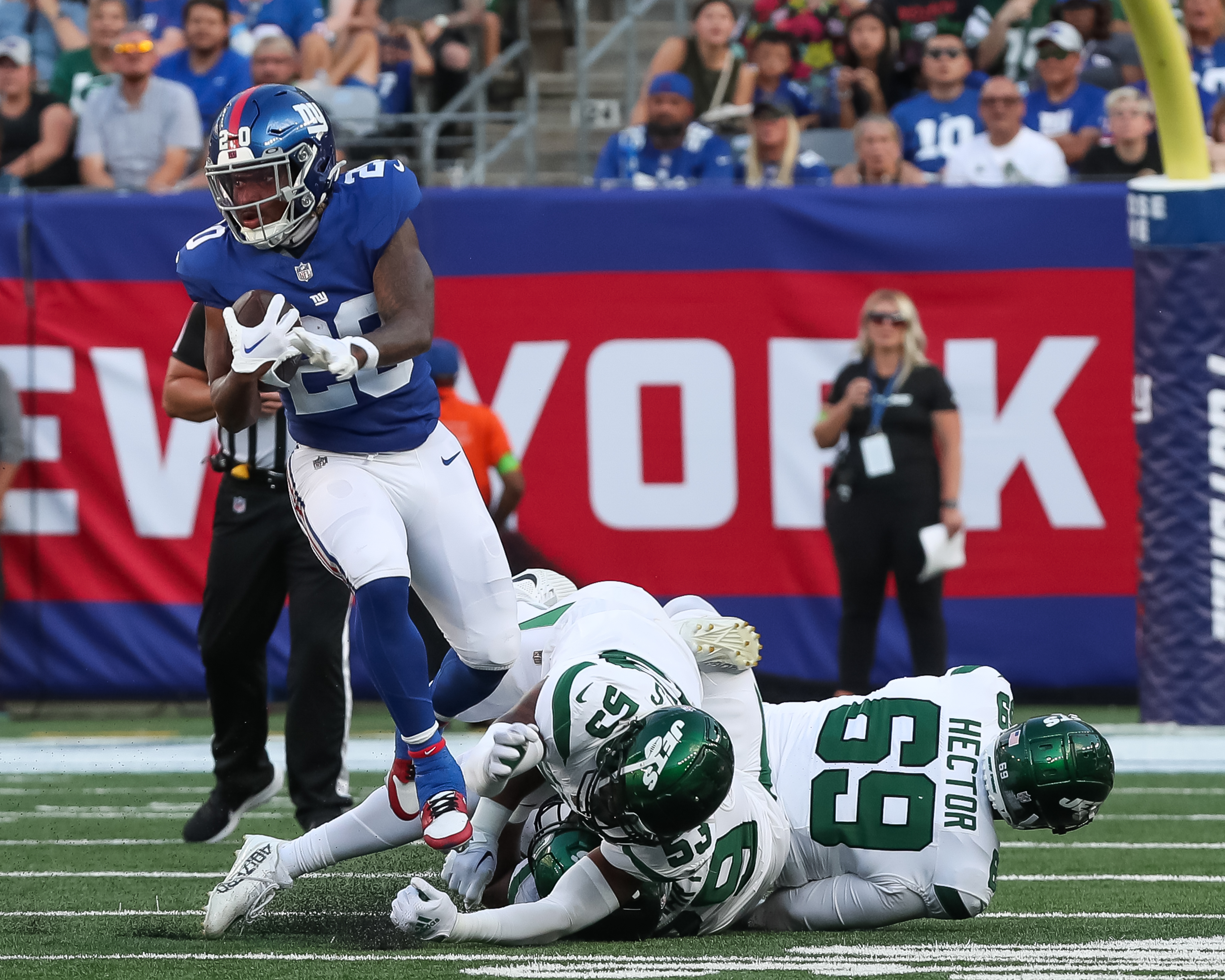 New York Giants running back Eric Gray (20) runs the ball during the first  half of an NFL preseason football game against the New York Jets, Saturday,  Aug. 26, 2023, in East