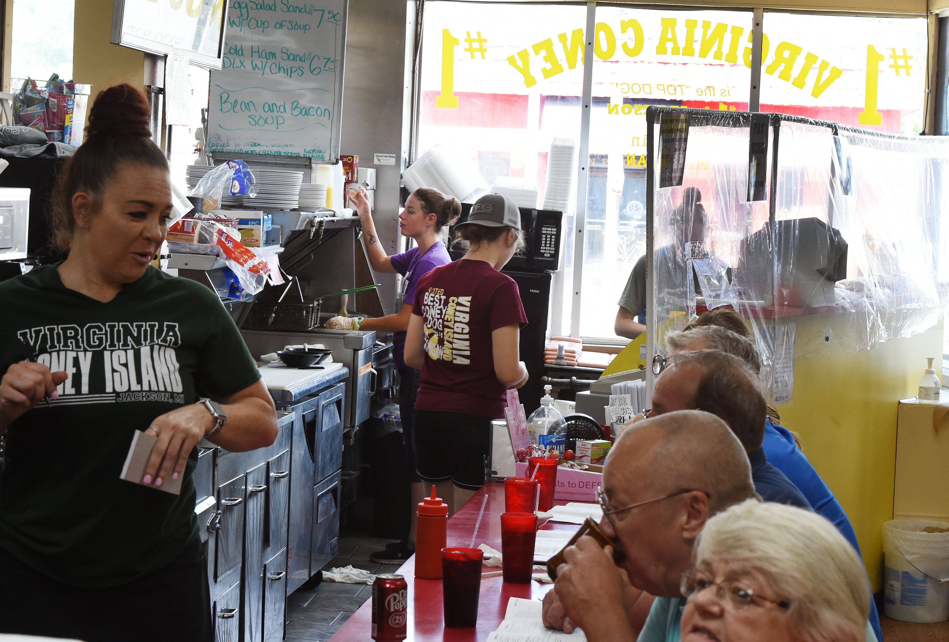 Staff works at Virginia Coney Island, 649 E. Michigan Ave., on Monday, July 6, 2020. The restaurant has been serving the Jackson community since 1914.