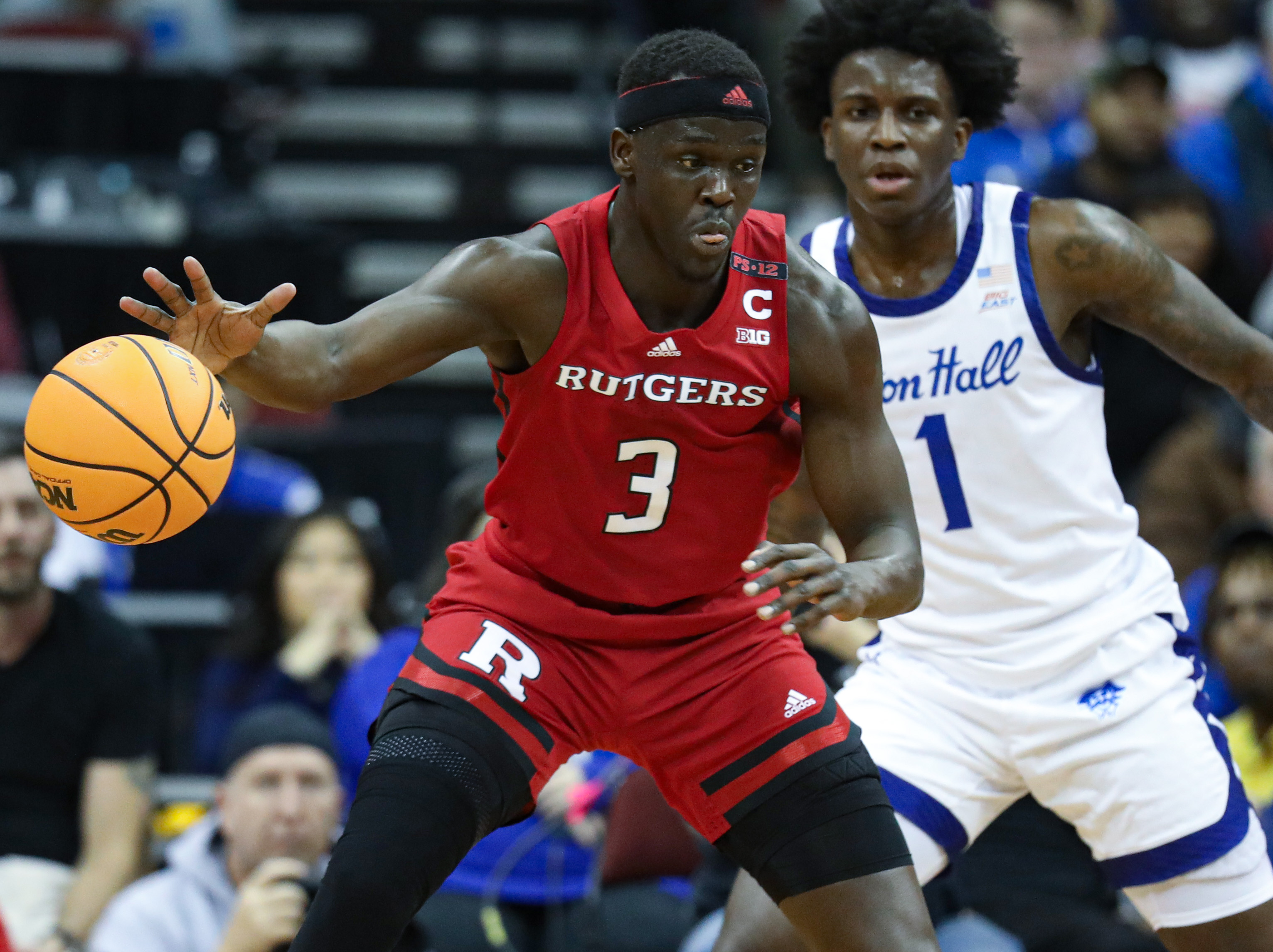 NCAA basketball Rutgers defeats Seton Hall, 7063