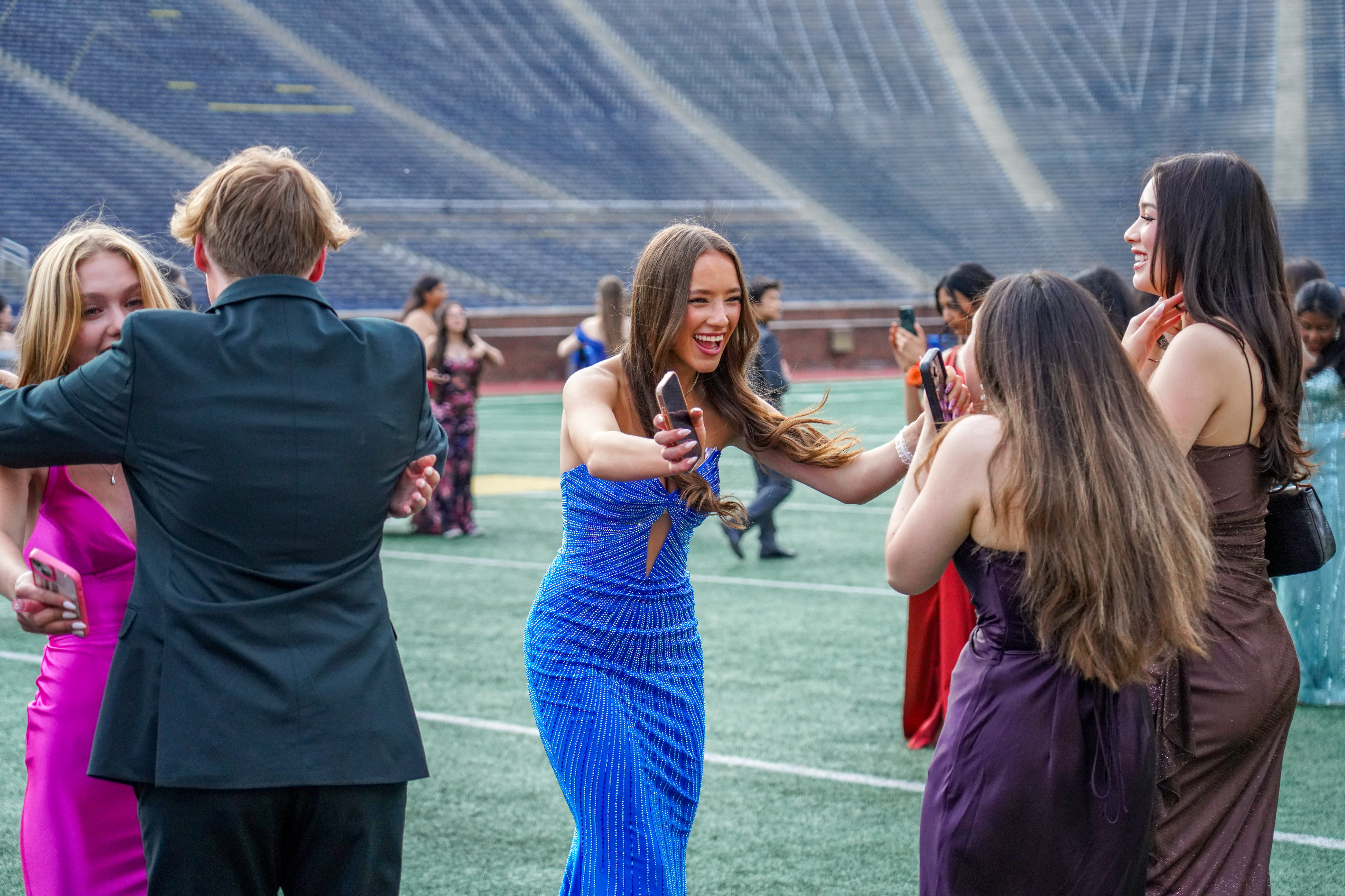 Ann Arbor Huron celebrates 2026 prom at Michigan Stadium - mlive.com