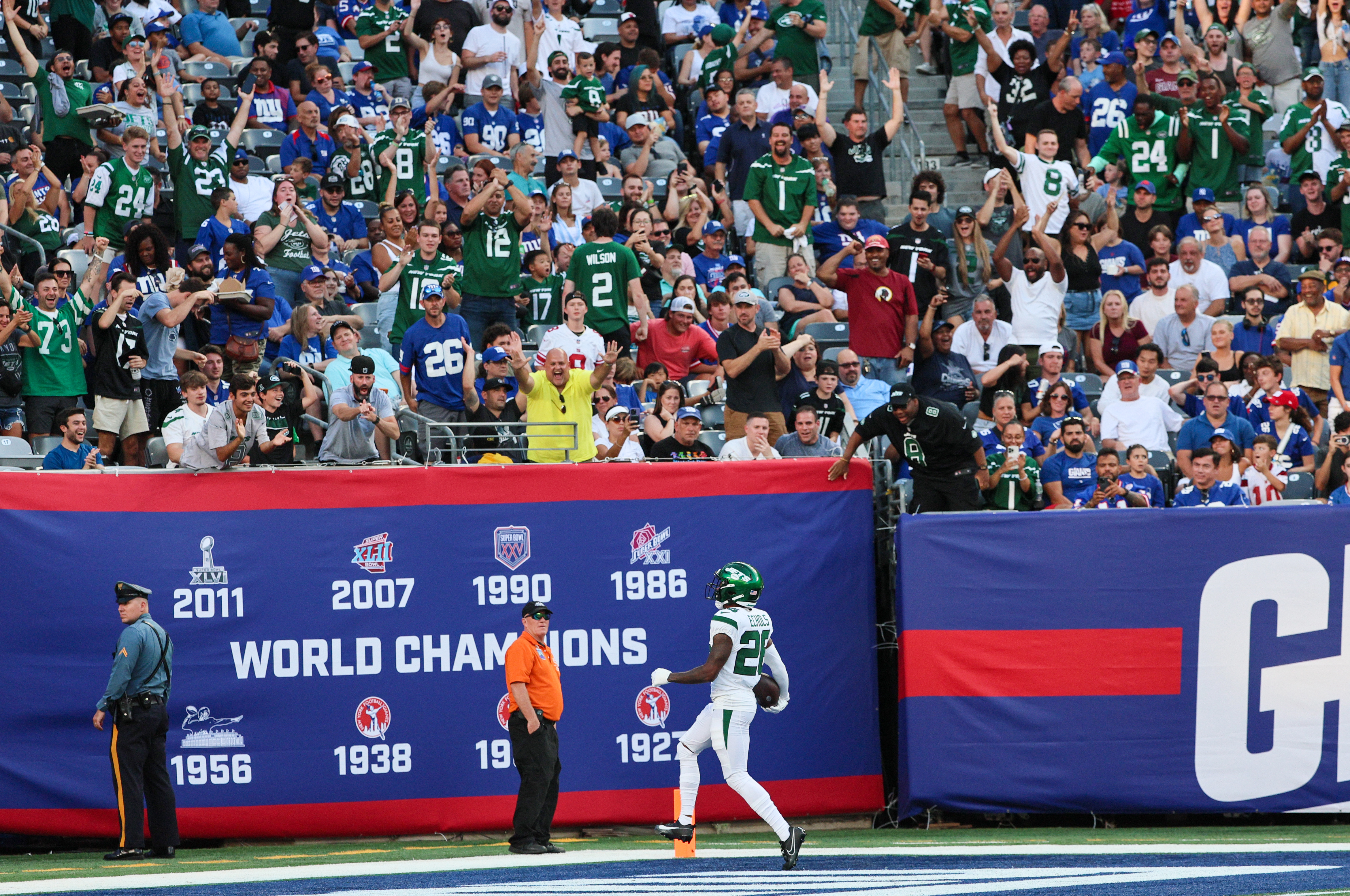 New York Jets offensive tackle Mekhi Becton (77) hugs quarterback Aaron  Rodgers (8) during an NFL football game against the New York Giants,  Saturday, Aug. 26, 2023 in East Rutherford, N.J. Jets