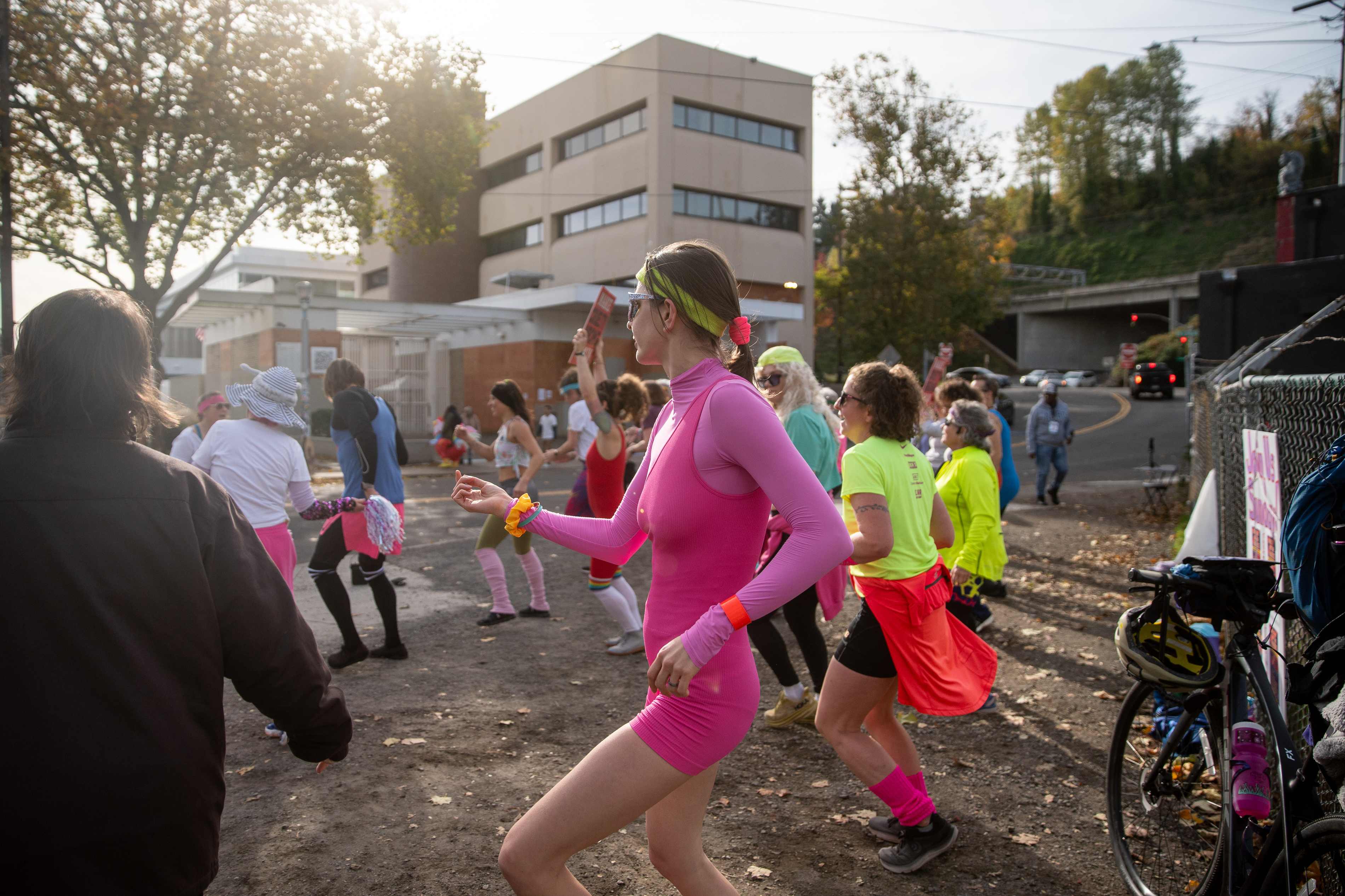 Participants in Fulcrum Fitness’s “Sweatin’ Out the Fascists” held an ’80s-aerobics peaceful protest outside the U.S. Immigration and Customs Enforcement (ICE) facility in South Portland on Sunday, Nov. 9, 2025, collecting donations for the Oregon Food Bank.