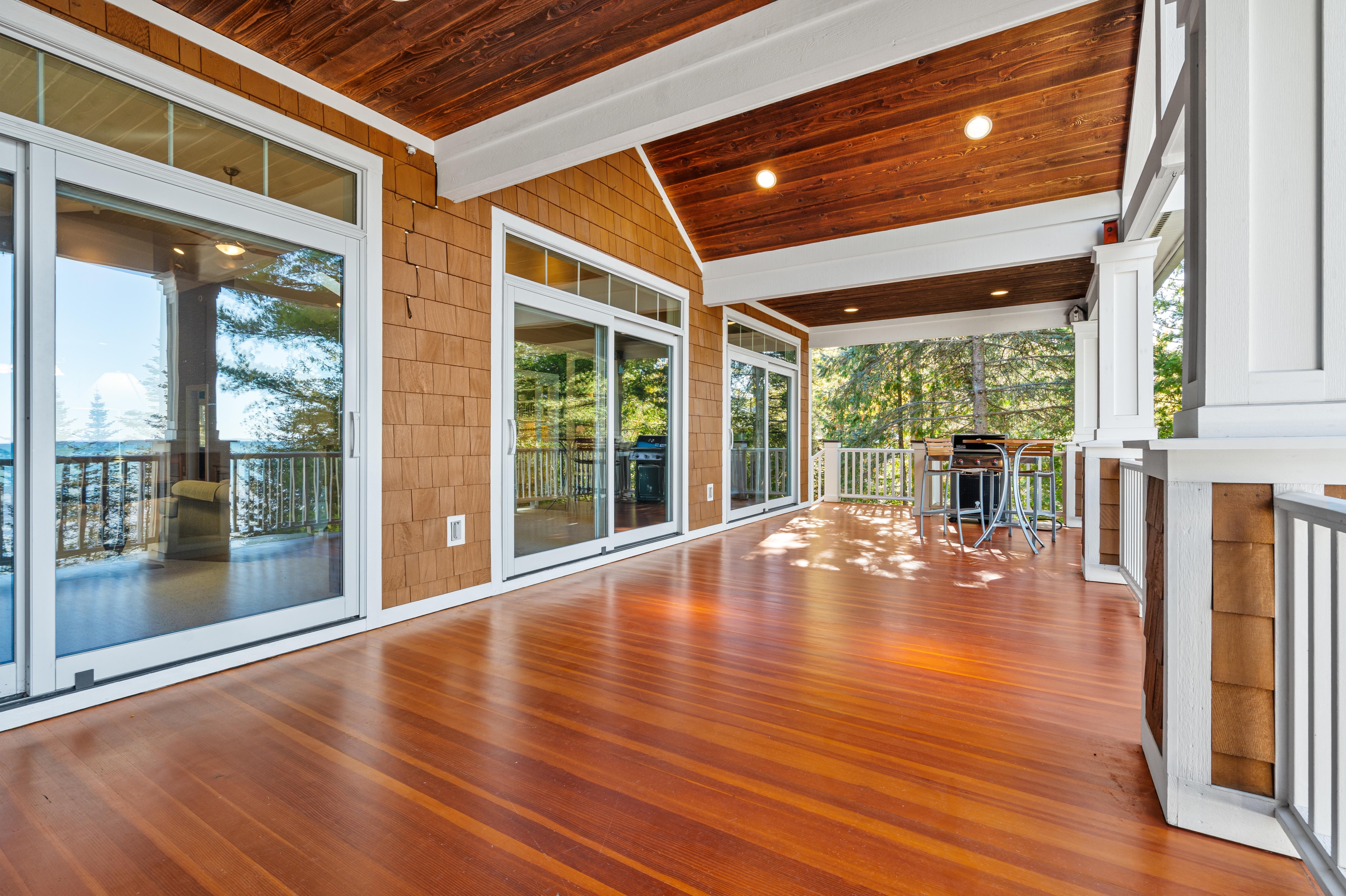 Exterior photographs of 4093 Lake Shore Drive in Charlevoix, this gem is listed at $2,099,900 through Berkshire Hathaway HomeServices Michigan Real Estate – Traverse City and The Crane Group with associate broker Johnny Crane and his brother, co-listing agent Matt Crane.