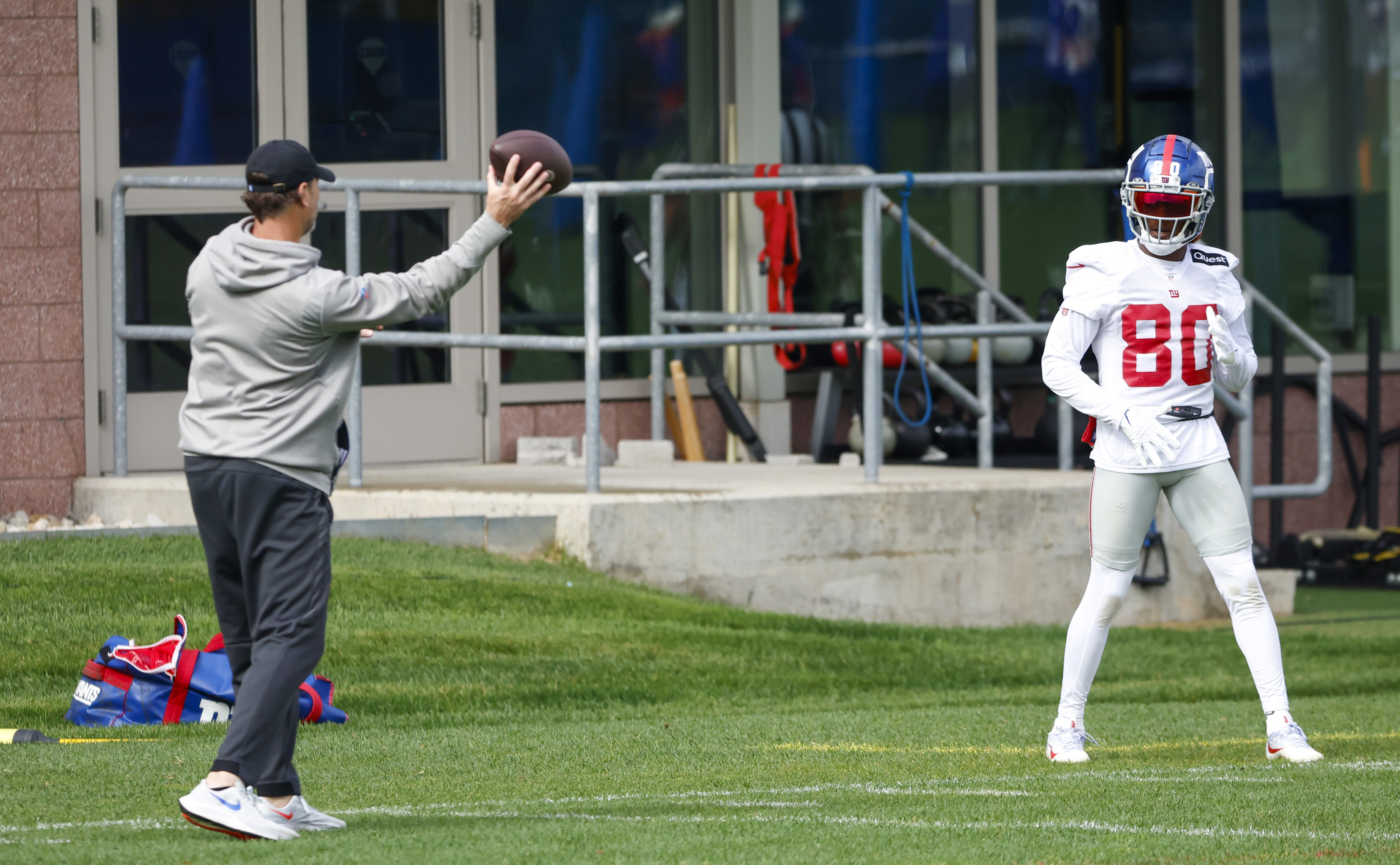 New York Giants wide receivers coach Mike Groh (left) works one-on-one with wide receiver Richie James (80) during practice on Wednesday, Oct. 26, 2022. 