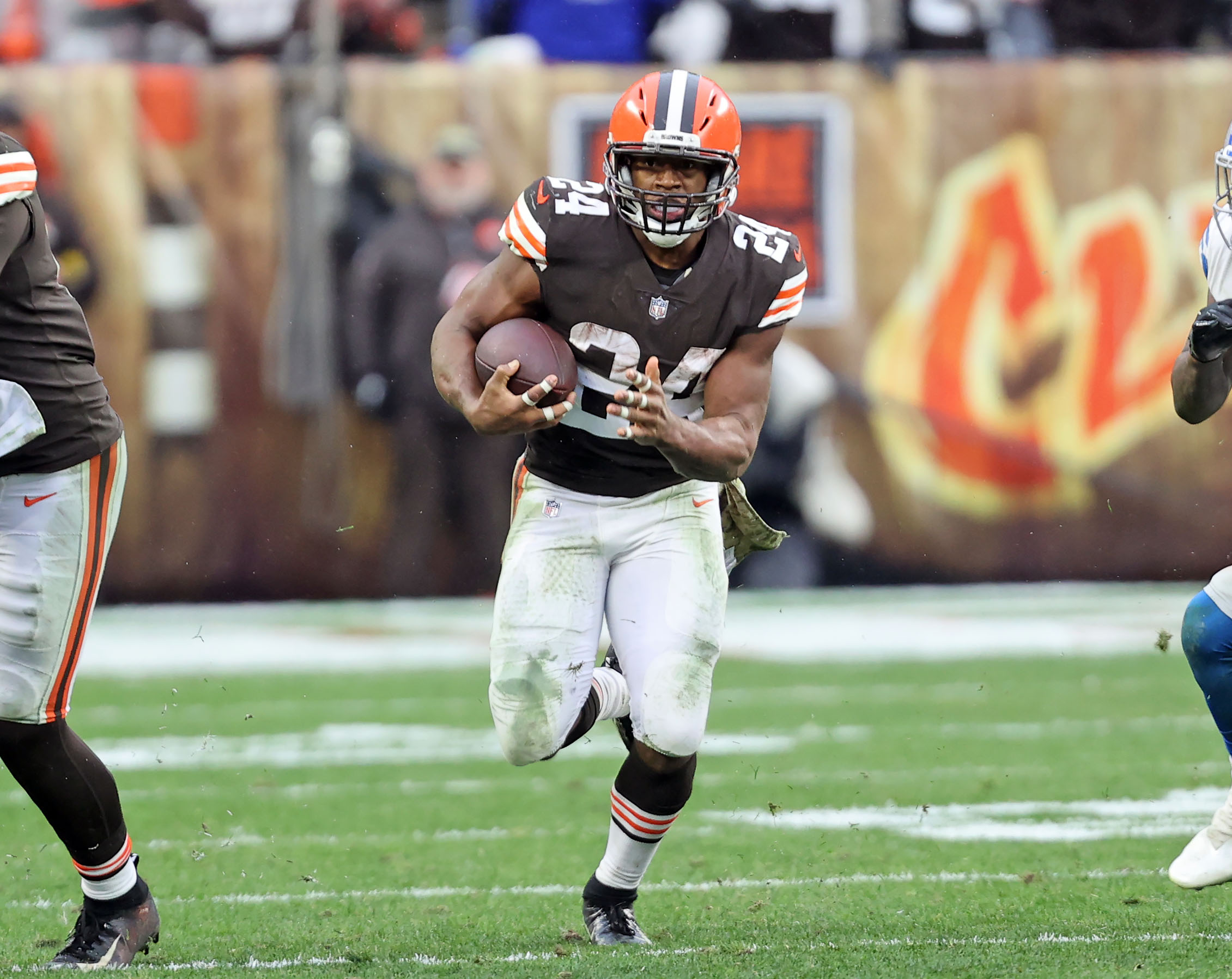 Cleveland Browns Nick Chubb Unsigned Brown Jersey Carrying Ball Photograph