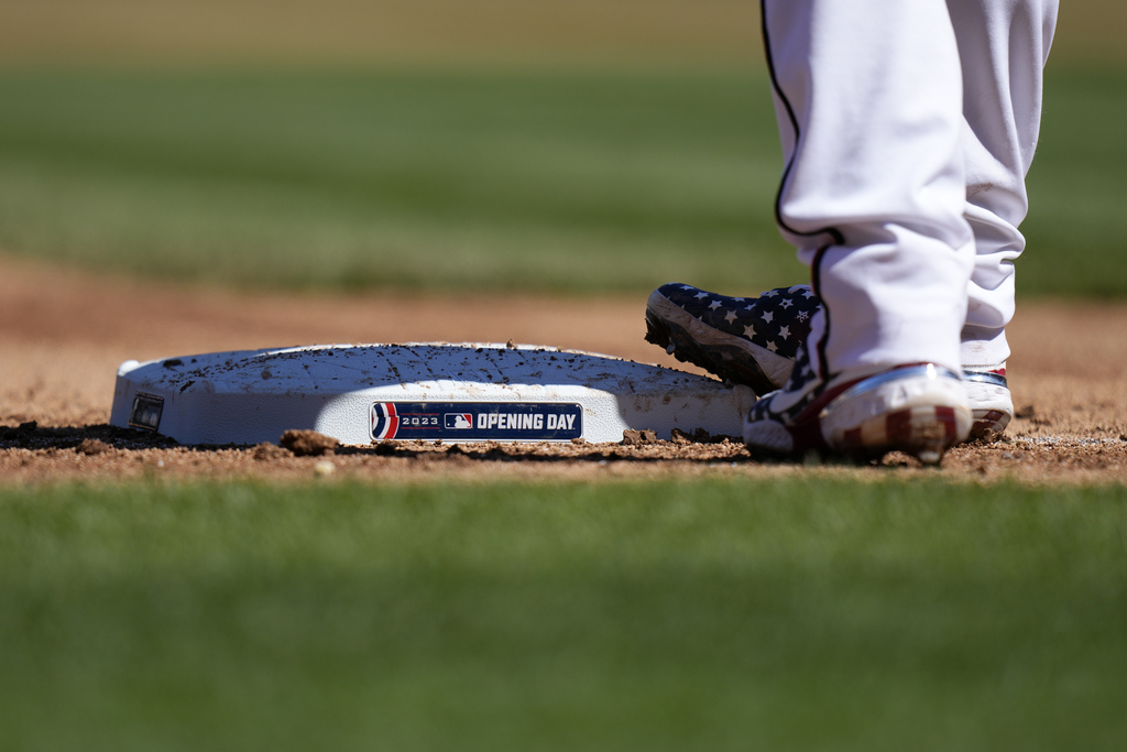 Kansas City Royals hall-0f-famers Frank White, left, and George Brett talk  on the field before an opening day baseball game against the Minnesota  Twins in Kansas City, Mo., Thursday, March 30, 2023. (