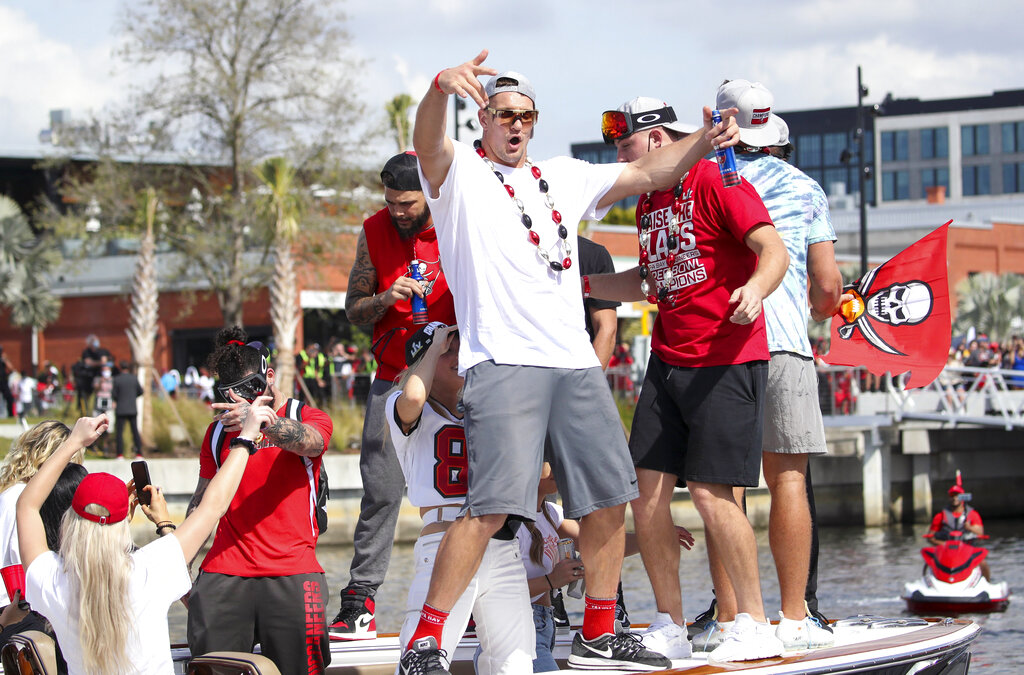 Tom Brady throws the Lombardi Trophy during Super Bowl Champion