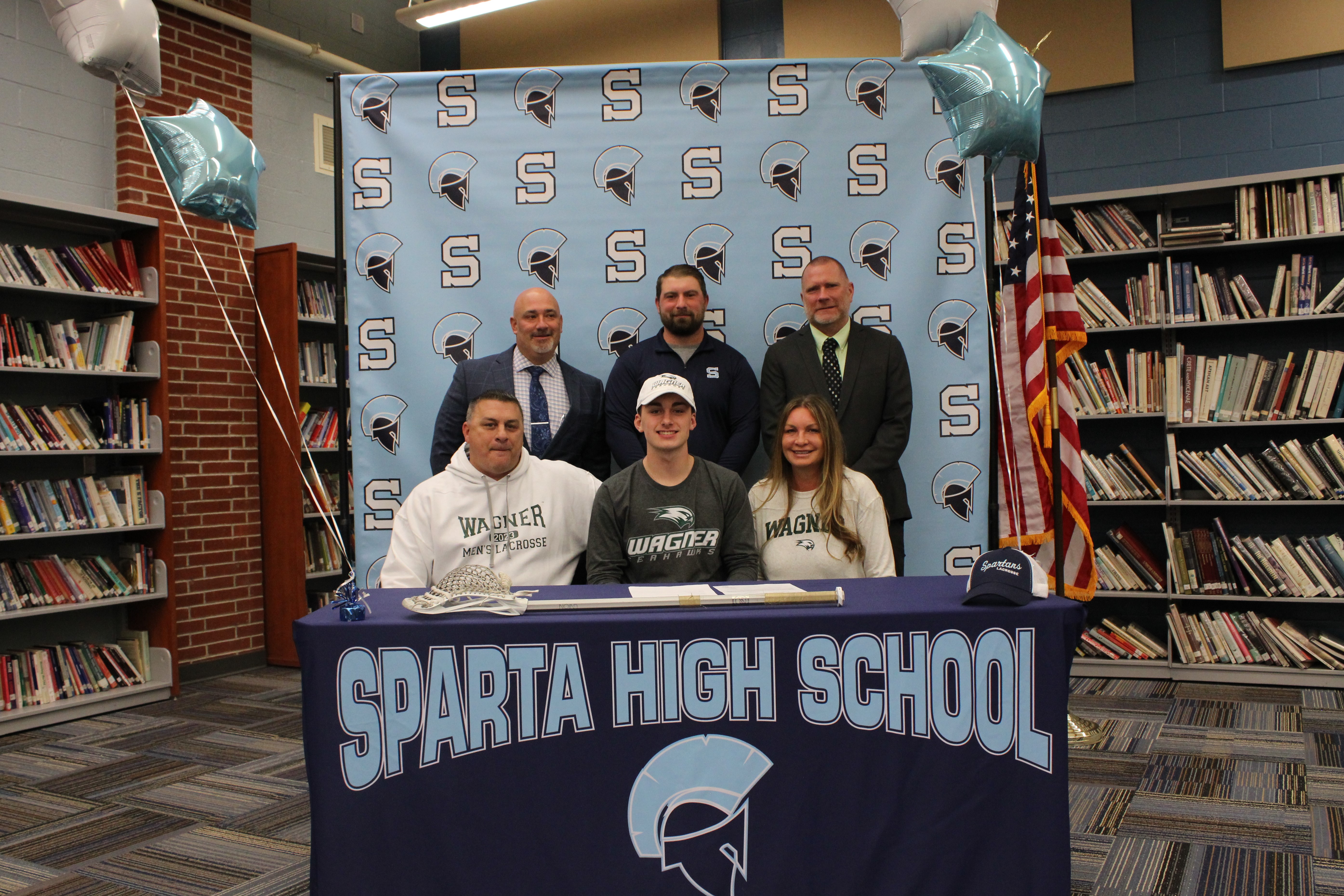 Ryan Rossi will continue his lacrosse career at Wagner College.  Pictured are: Back row: Dr. Ed Lazzara, Principal; Sean Peterson, head coach and Steve Stoner, AD
Front row: Steven Rossi, Ryan Rossi and Donna Rossi