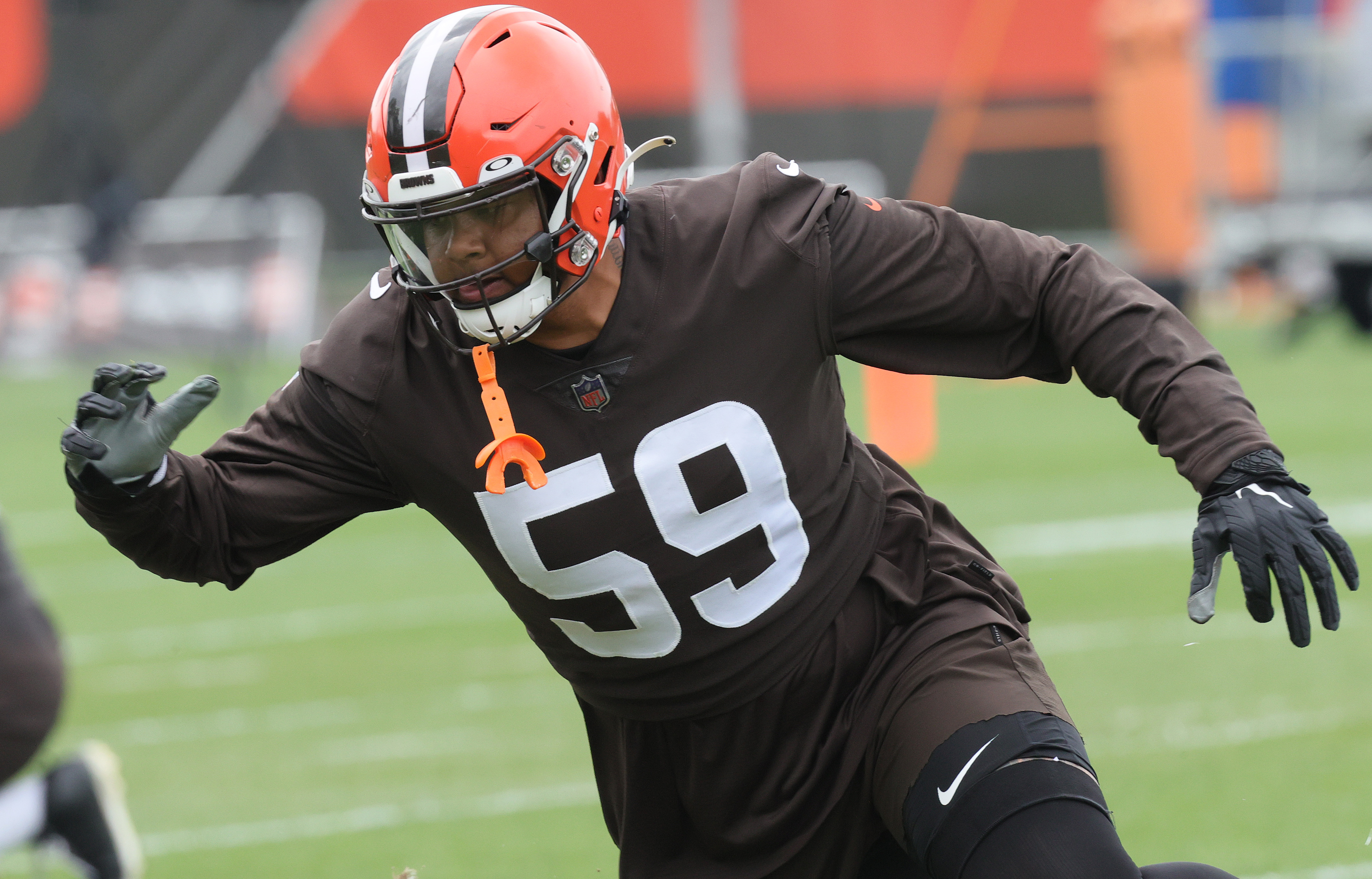 Cleveland Browns defensive end Romeo McKnight (57) runs off of the line of  scrimmage during an