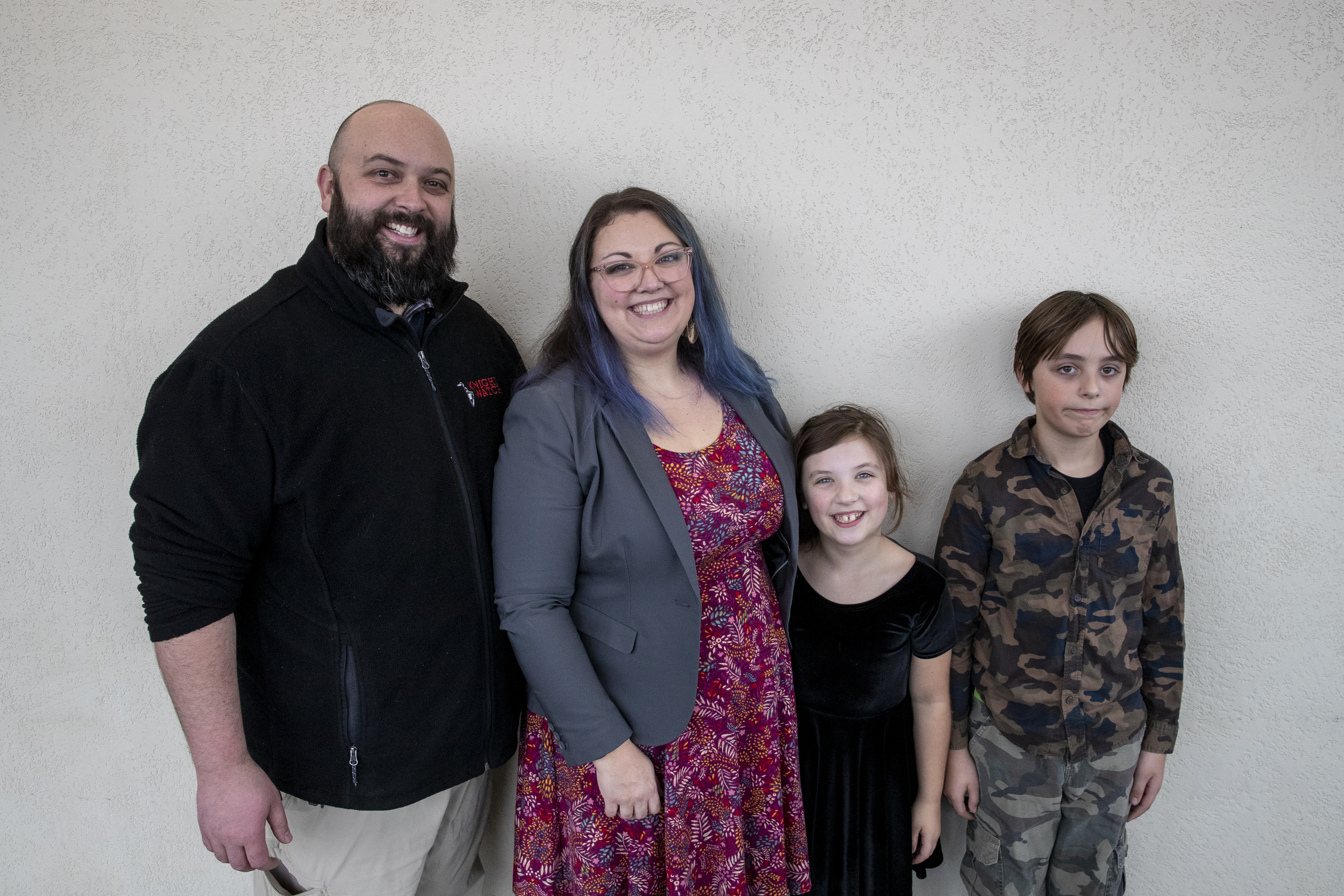 Lauren Vermilye poses for a picture with her husband, Jonathan, and children, Tristan, 11, and Victoria, 8, during Adoption Day at the Kent County Courthouse in Grand Rapids on Thursday, Dec. 8, 2022. Tammy and Jordan Myers are the biological parents of 1-year-old twins Eames and Ellison. Lauren Vermilye, a surrogate, gave birth to the twins after Tammy went through breast cancer treatment and has no claim to the babies. The Myers family was able to adopt the twins after convincing the court system to grant them custody. (Cory Morse | MLive.com)
