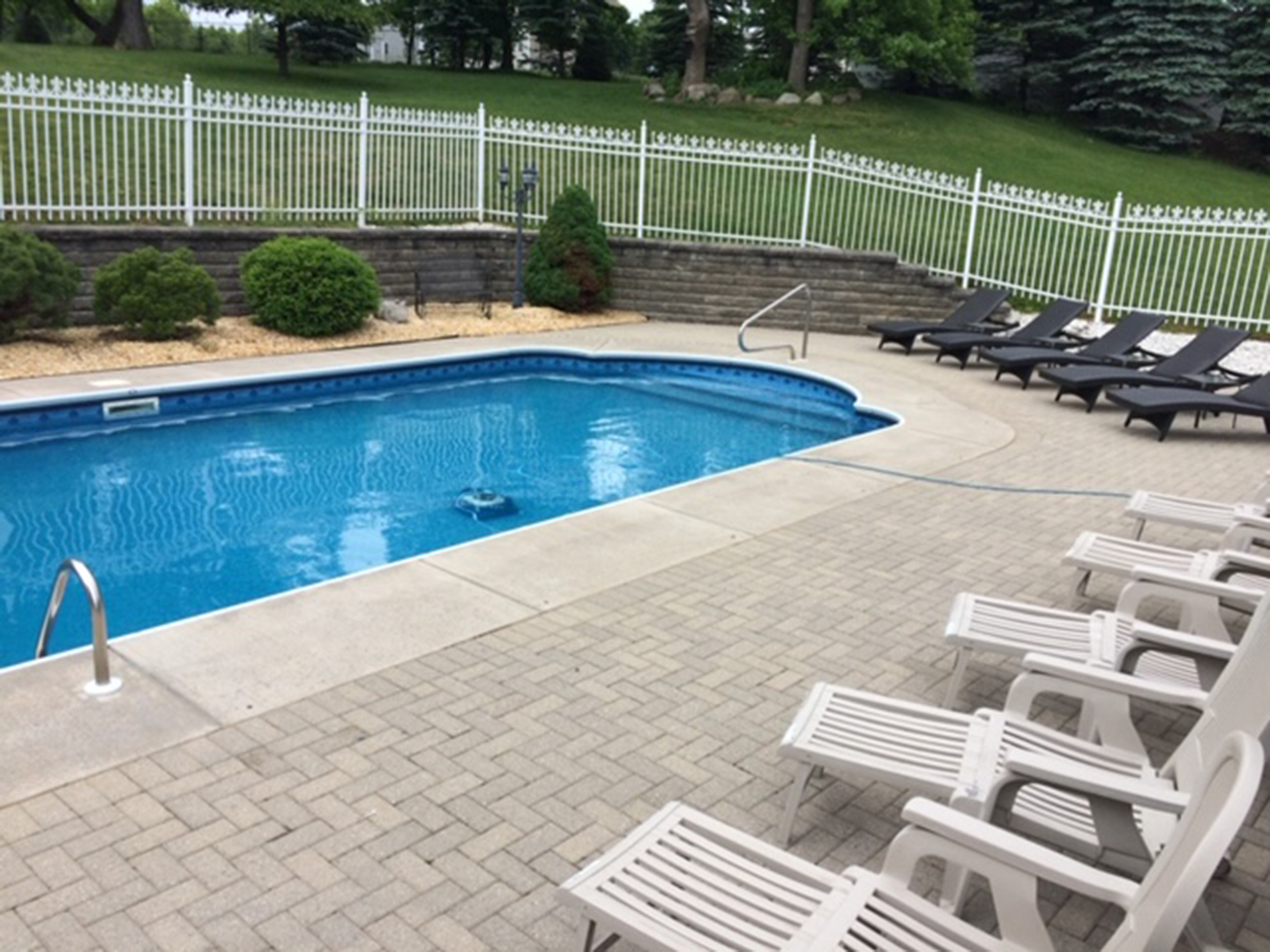 Brick Camillus home sits atop a hill overlooking six acres