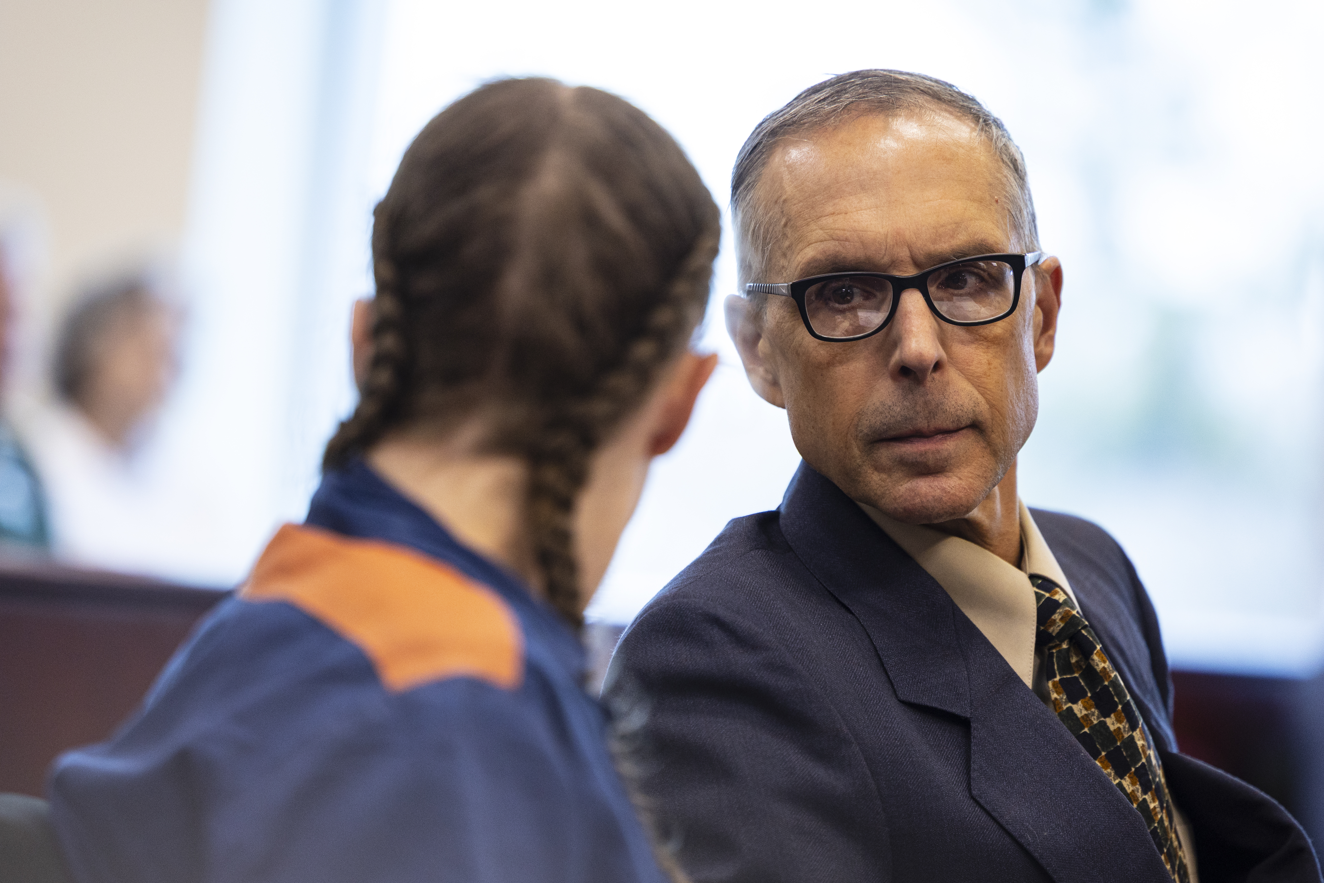 Ronald Ambrose, appellate defense attorney, talks with Shanda Vander Ark, the mother convicted of torturing her 15-year-old son to death, after she testified during a Ginther hearing seeking a new trial at Muskegon County Circuit Court in Muskegon, Mich. on Friday, March 20, 2026. Vander Ark’s defense claims she was in a “catatonic state” throughout her trial that featured disturbing testimony of how she inflicted cruel punishments on her son, Timothy Ferguson, leading to the boy’s death. She is currently serving life in prison without parole.
