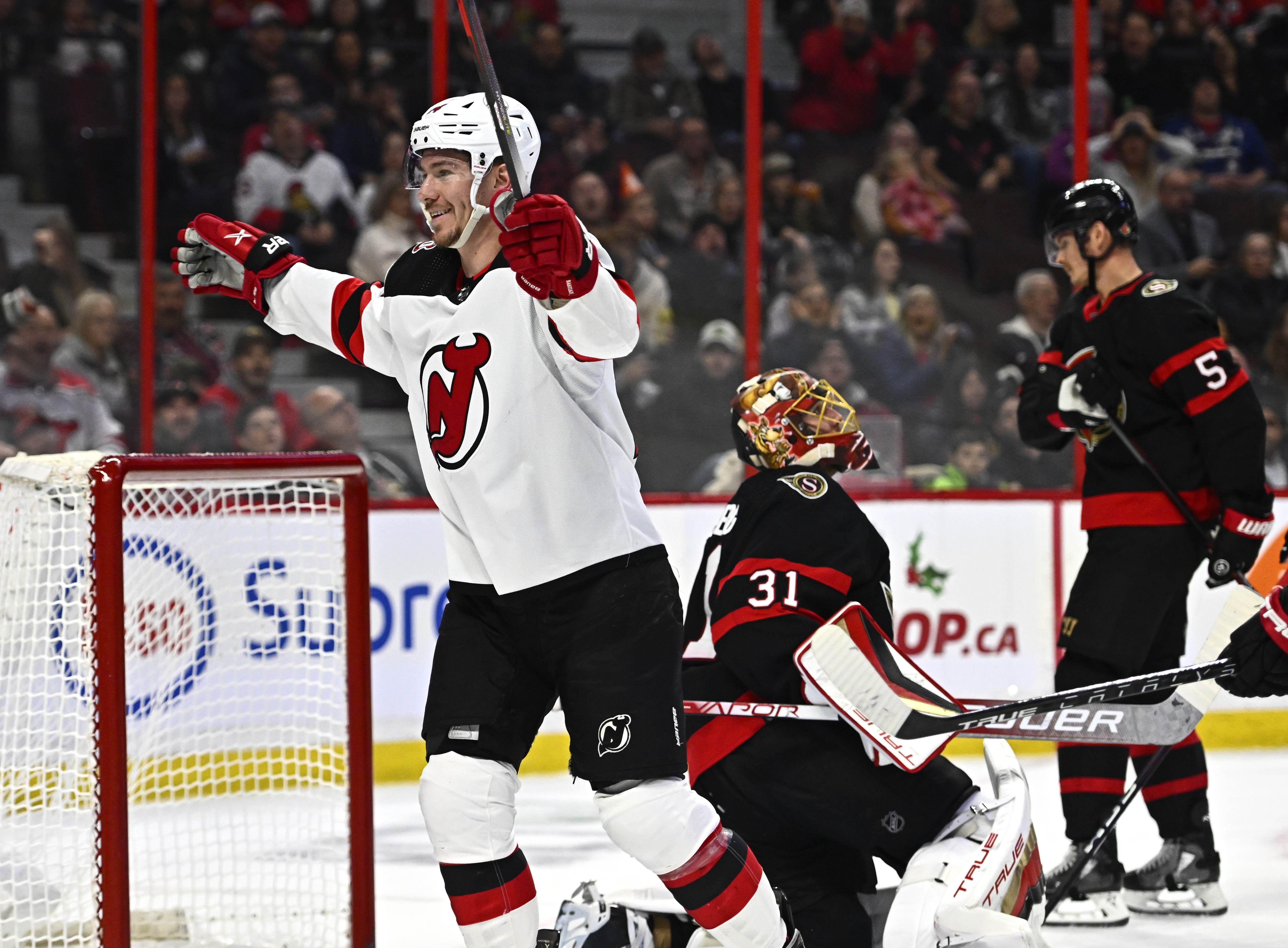 Schmid backstops Devils to 12th straight win with 25 saves against