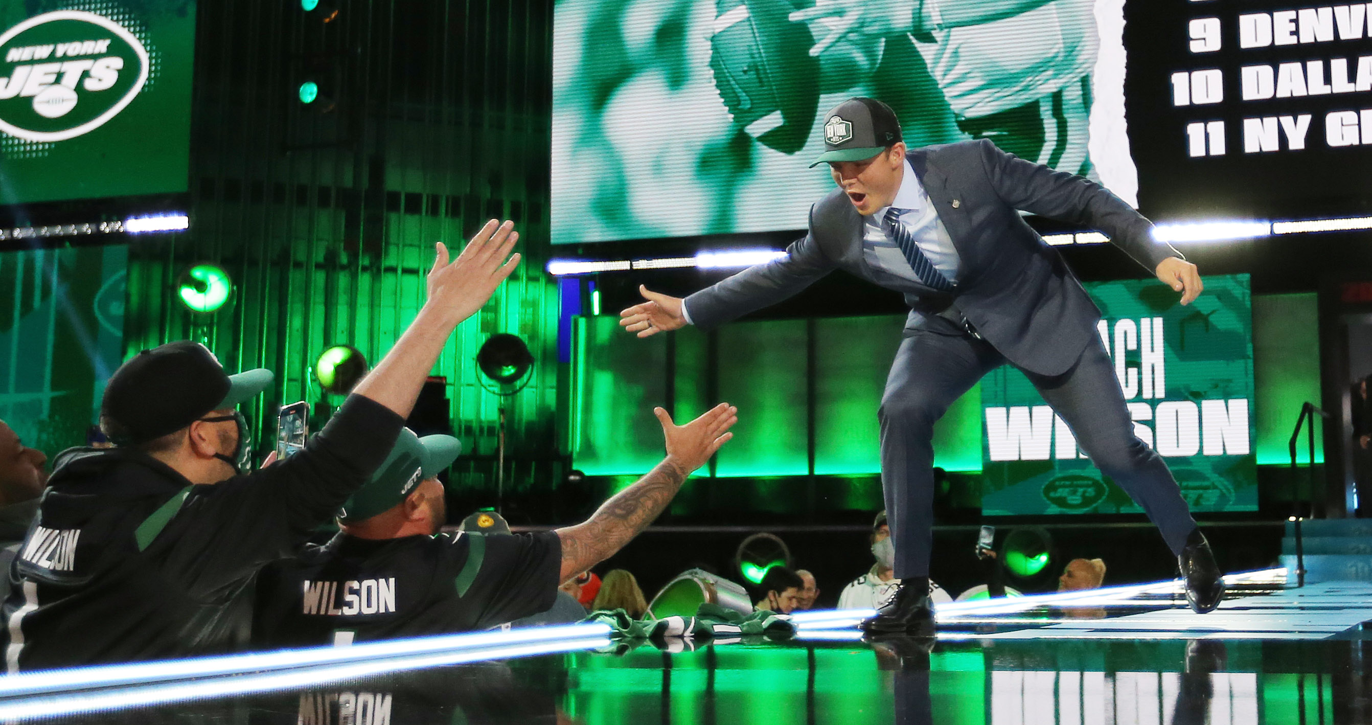 BYU quarterback Zach Wilson holds a New York Jets jersey on stage after  being selected second overall in the first round of the NFL football draft,  Thursday, April 29, 2021, in Cleveland. (