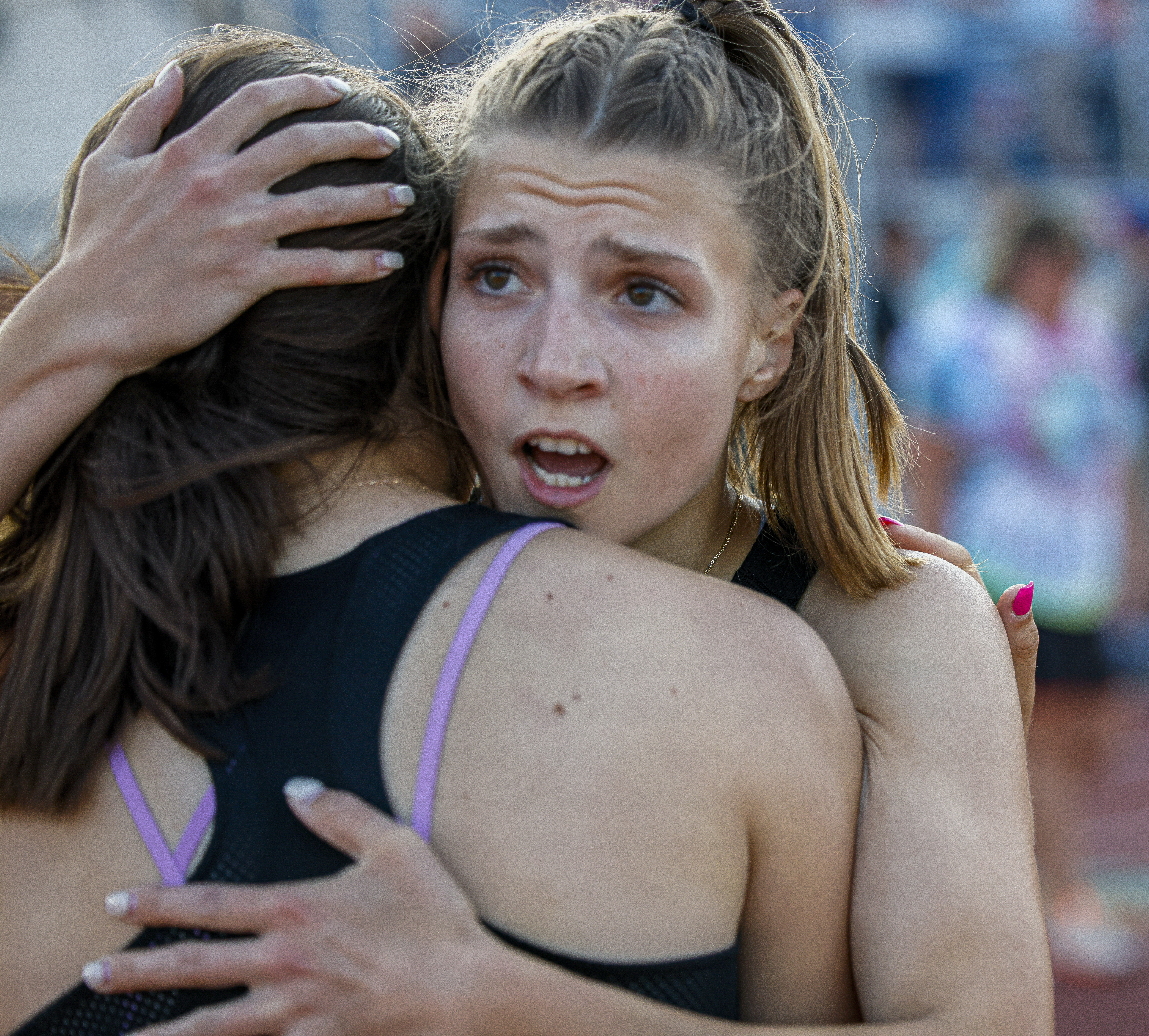 J-D winner in the high hurdles gets a victory hug at the boys and girls Section III track & field qualifier at Cicero-North Syracuse High School Thursday, June 1, 2023. N. Scott Trimble | strimble@syracuse.com