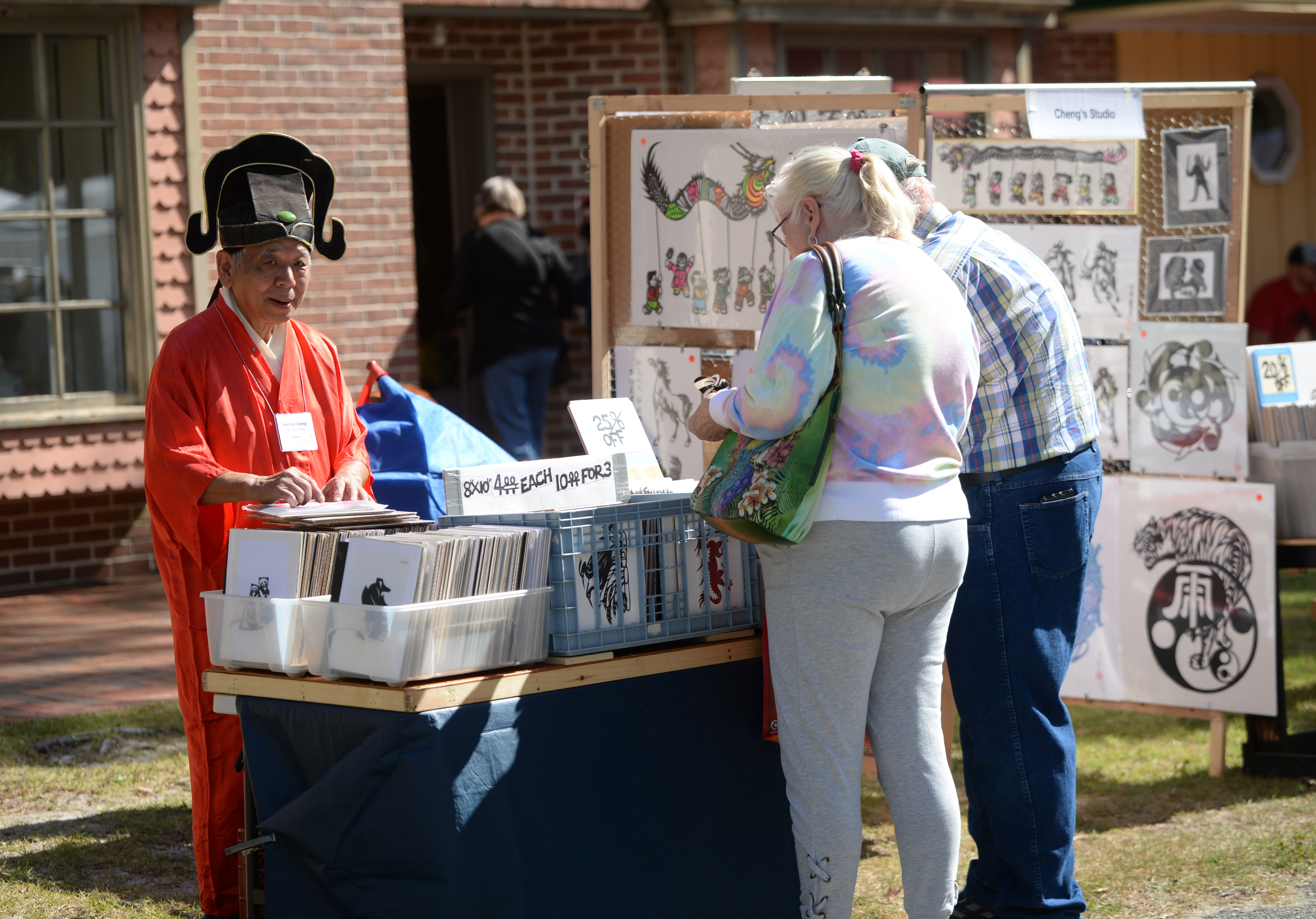 Hou-Tien Cheng sells supper cutting during the 22nd annual Festival of Fine Craft at Wheaton Arts in Millville, Saturday, Oct. 2, 2021.