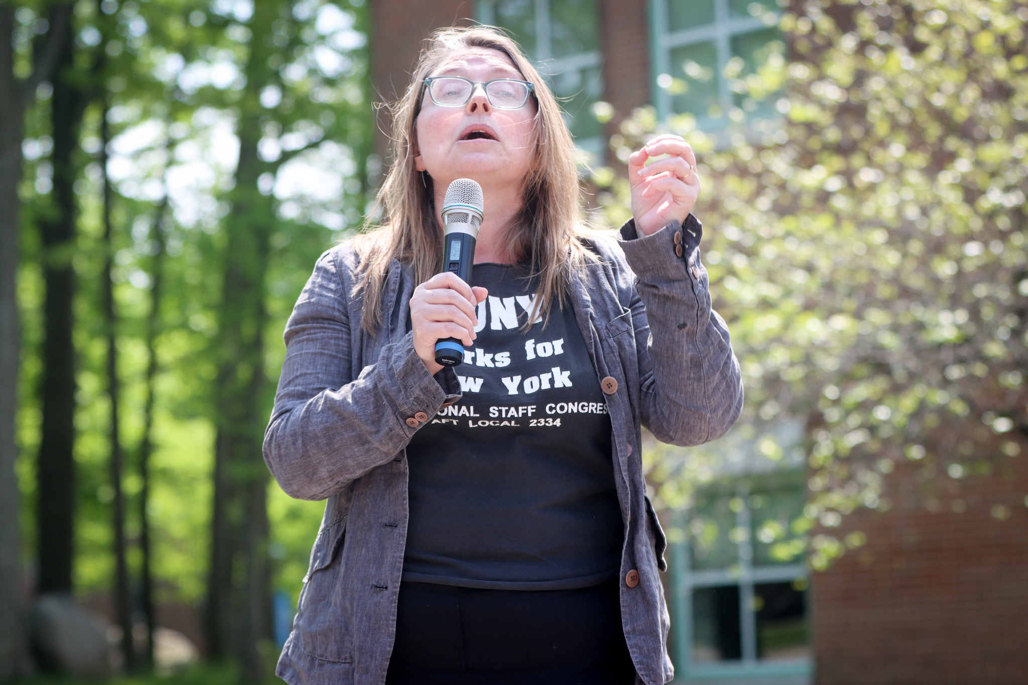 - Penny Lewis, secretary of the PSC and labor and urban studies professor at the CSI, speaks at the rally on campus before the March for a New Deal for CUNY on May 9, 2023.