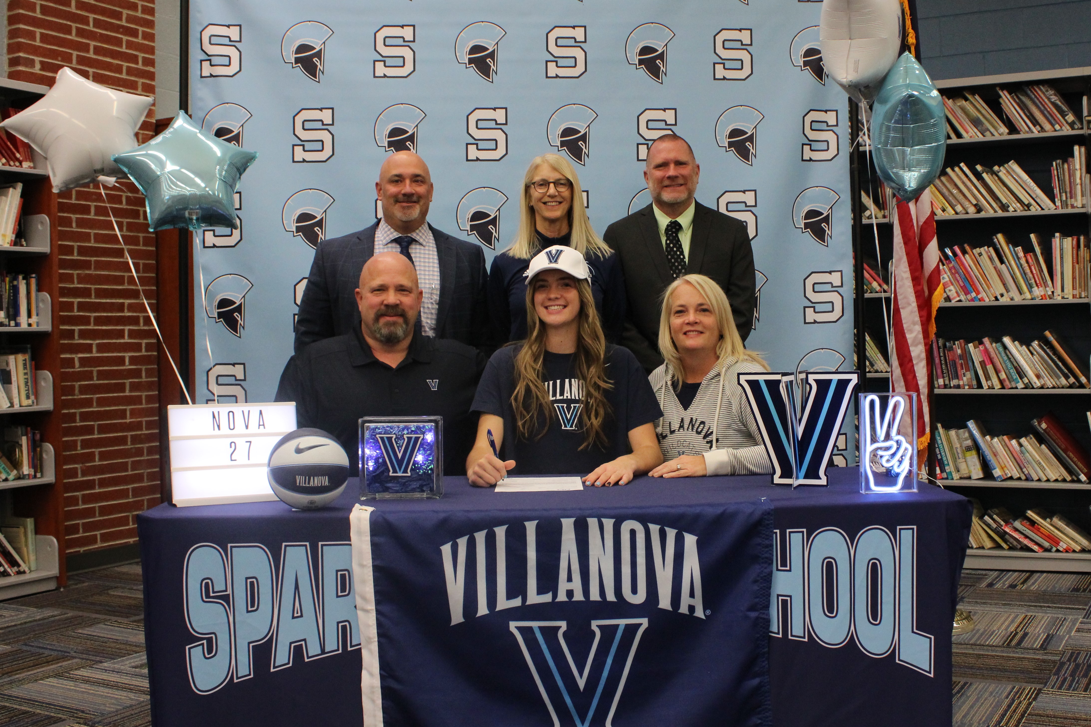 Brynn McCurry will continue her basketball career at Villanova.  Pictured are: Back row: Dr. Ed Lazzara, Principal; Cathy Wille, Head Coach and Steve Stoner, AD
Front Row: Matt McCurry, Brynn McCurry and Colleen McCurry