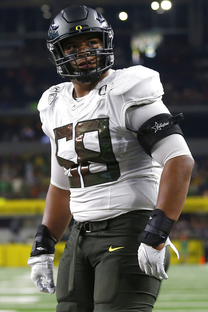 FILE PHOTOS).former Oregon Ducks offensive tackle (58) Penei