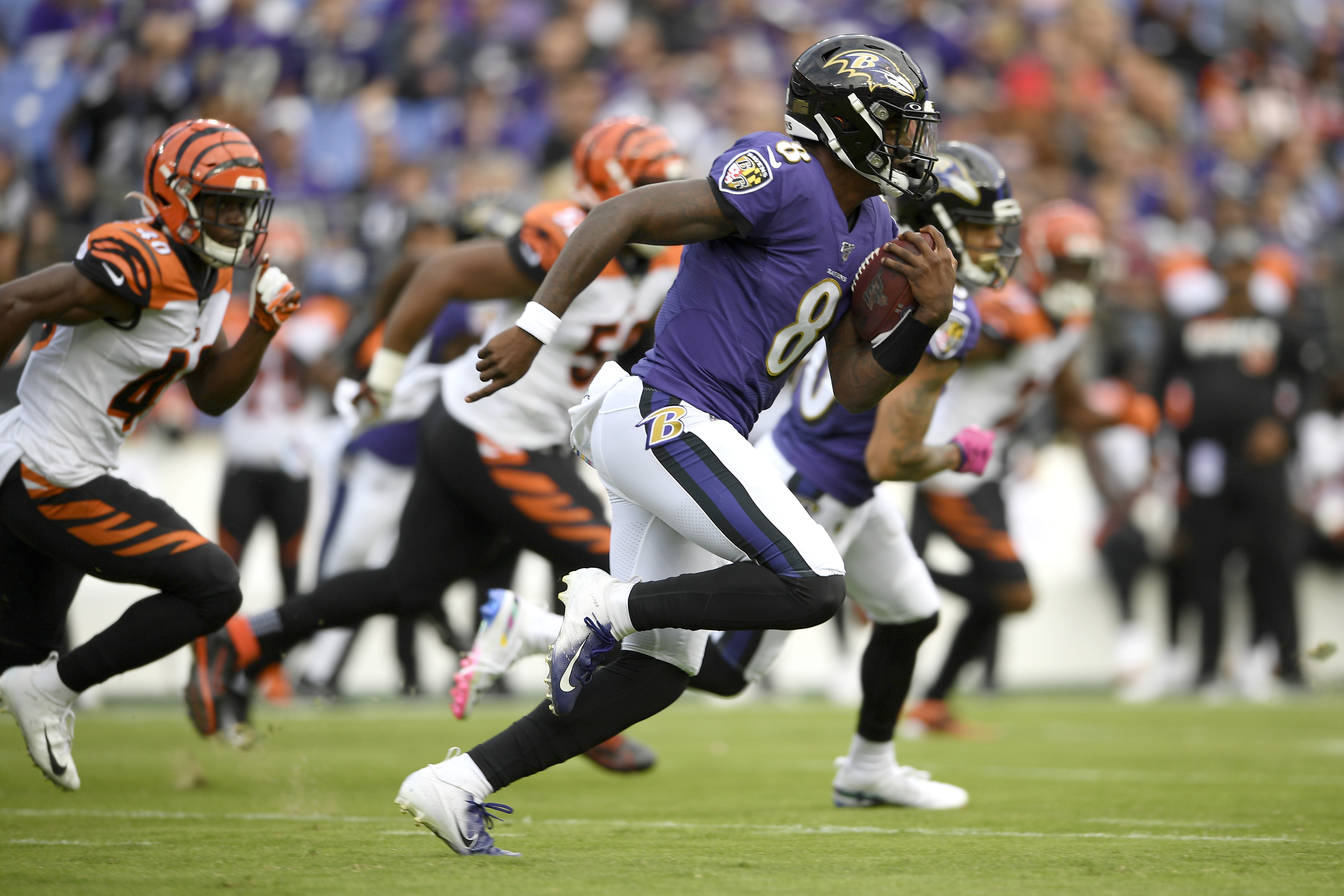 Baltimore Ravens quarterback Lamar Jackson looks to pass against the  Cincinnati Bengals during the first half of a NFL football game Sunday,  Oct. 13, 2019, in Baltimore. (AP Photo/Nick Wass Stock Photo 