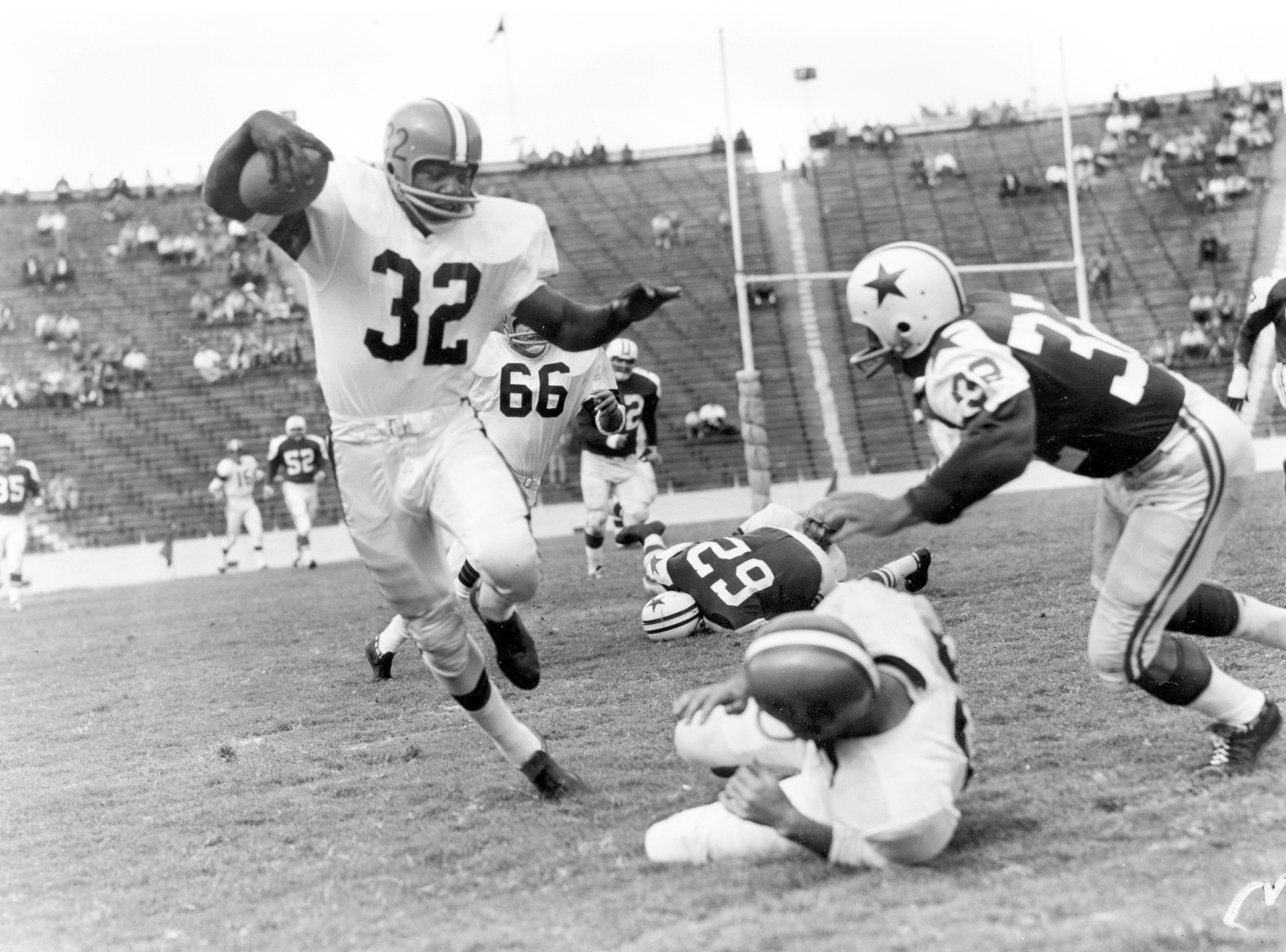 Fullback Jim Brown of Cleveland ran into a human wall on last-quarter play  of game against San Francisco Nov. 30, 1959 in Cleveland, Ohio. Brown  gained only a yard but picked up