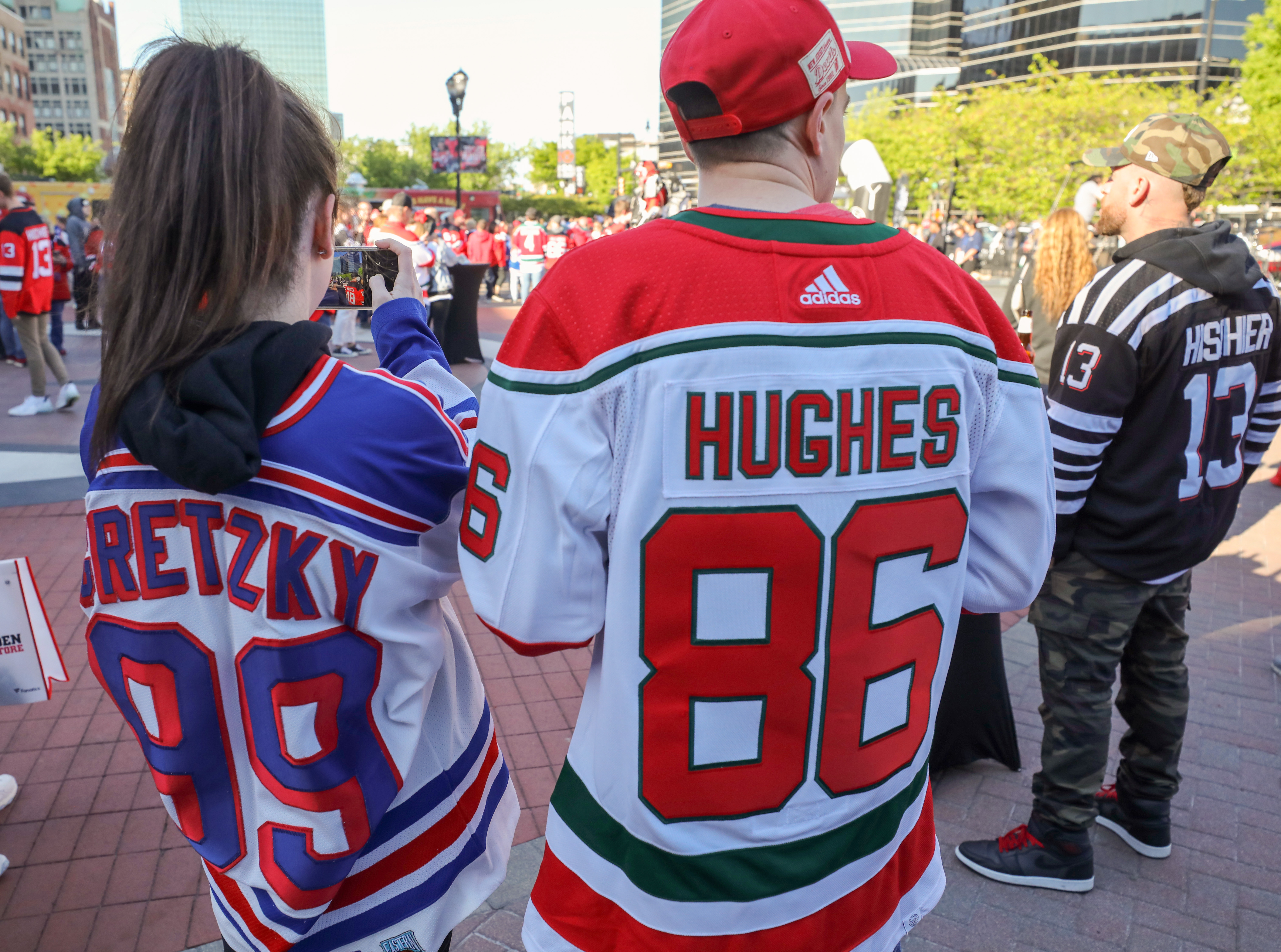 Sara Depaoli and Michael Cinnante of Newburgh, NY are wearing Wayne Gretzky and Jack Hughes jerseys outside Prudential Center on Tuesday, April 18, 2023 in Newark, N.J. The Devils lost to the New York Rangers, 5-1, in Game 1 of the NHL Stanley Cup playoffs.