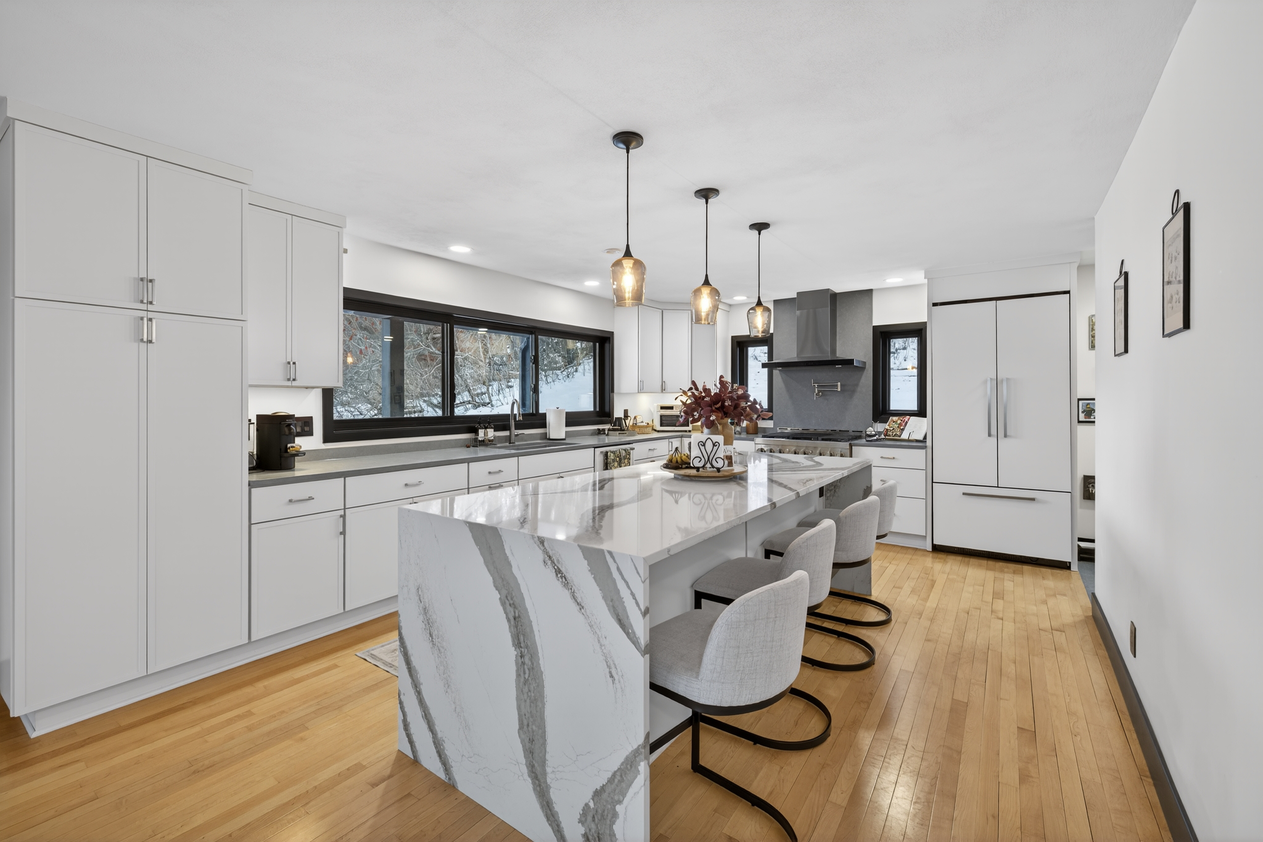 - Christina Cianciosi grew up admiring the house at 101 Alton Street in Syracuse which borders Bellevue Country Club. In 2022, she bought the unique home and gave it an extensive renovation. The new custom kitchen features a 12-foot quartz island with a waterfall's edge. No cabinetry was installed on the right hand wall for easy access to the fridge and buffets. Courtesy of Kyle Fedrizzi, owner of kfotography315, LLC.
