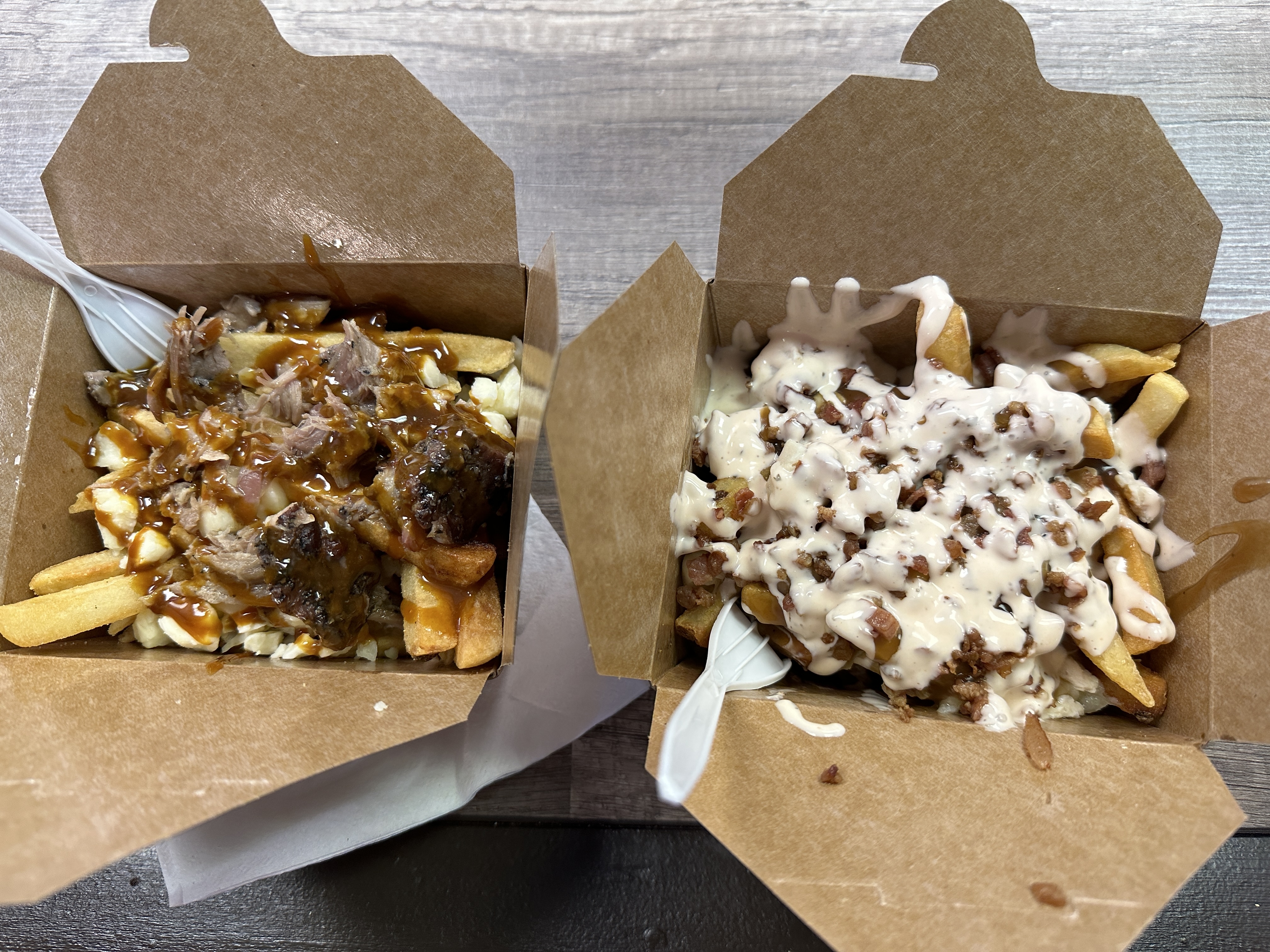 Poutine Gourmet at the 2023 NYS Fair. Pulled pork poutine and chicken bacon ranch poutine. Sunny Hernandez | ahernandez@nyup.com