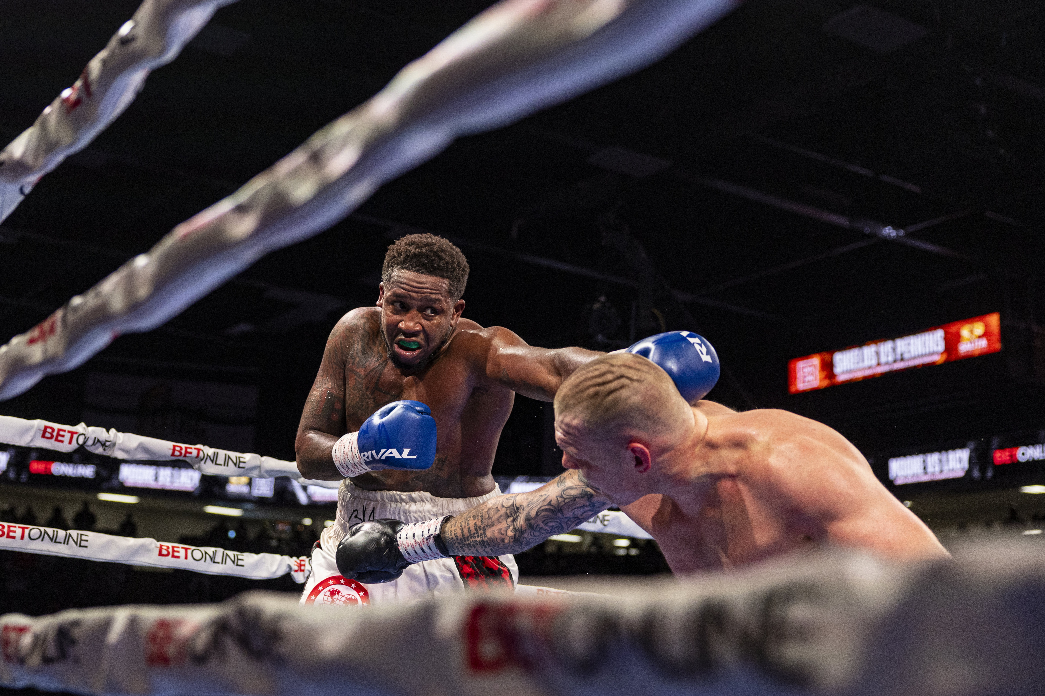 Boxers fly out of the ring and into crowd in WWE style at Michigan bout ...