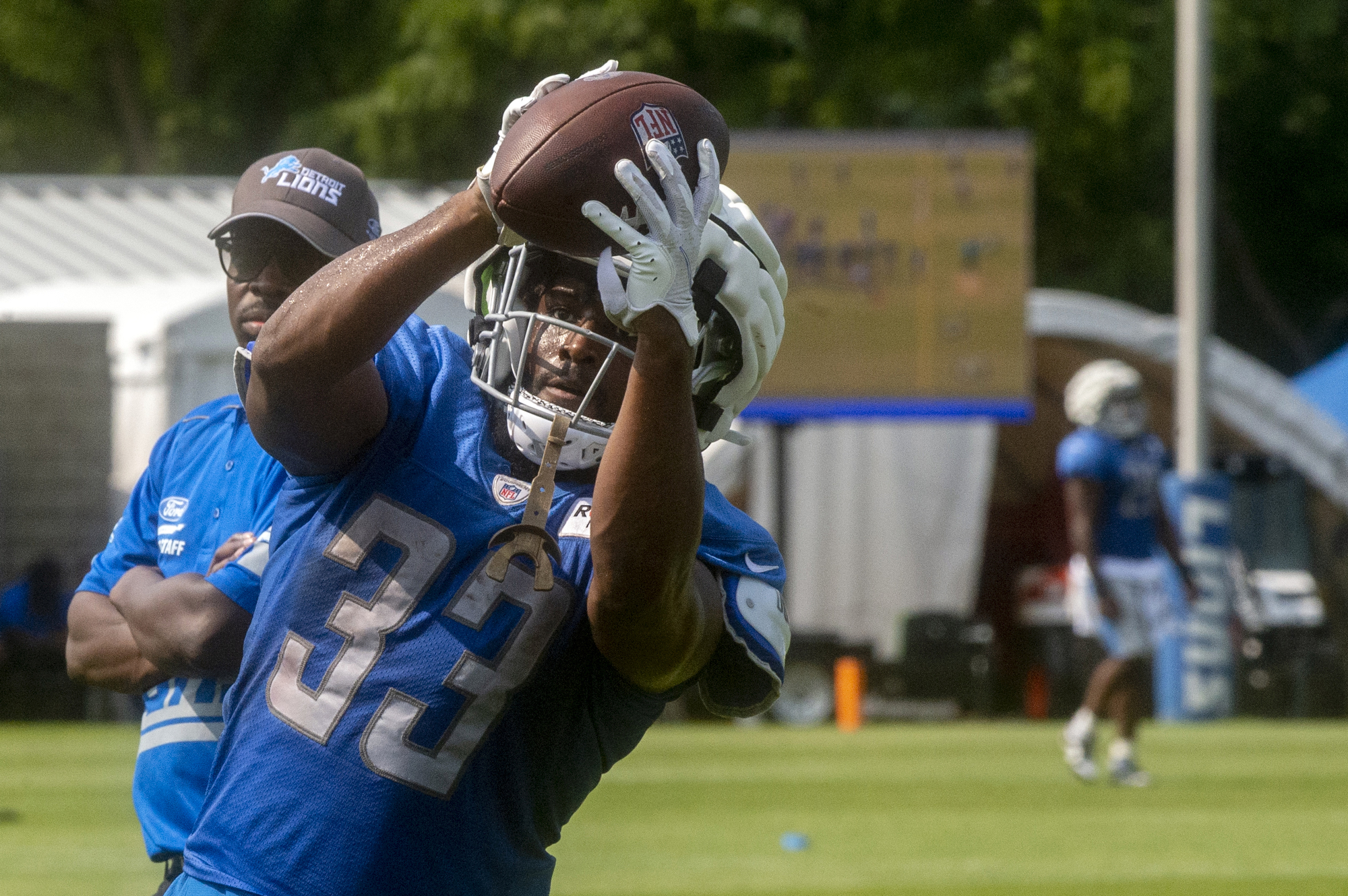 Detroit Lions linebacker Trevor Nowaske runs a drill during an NFL