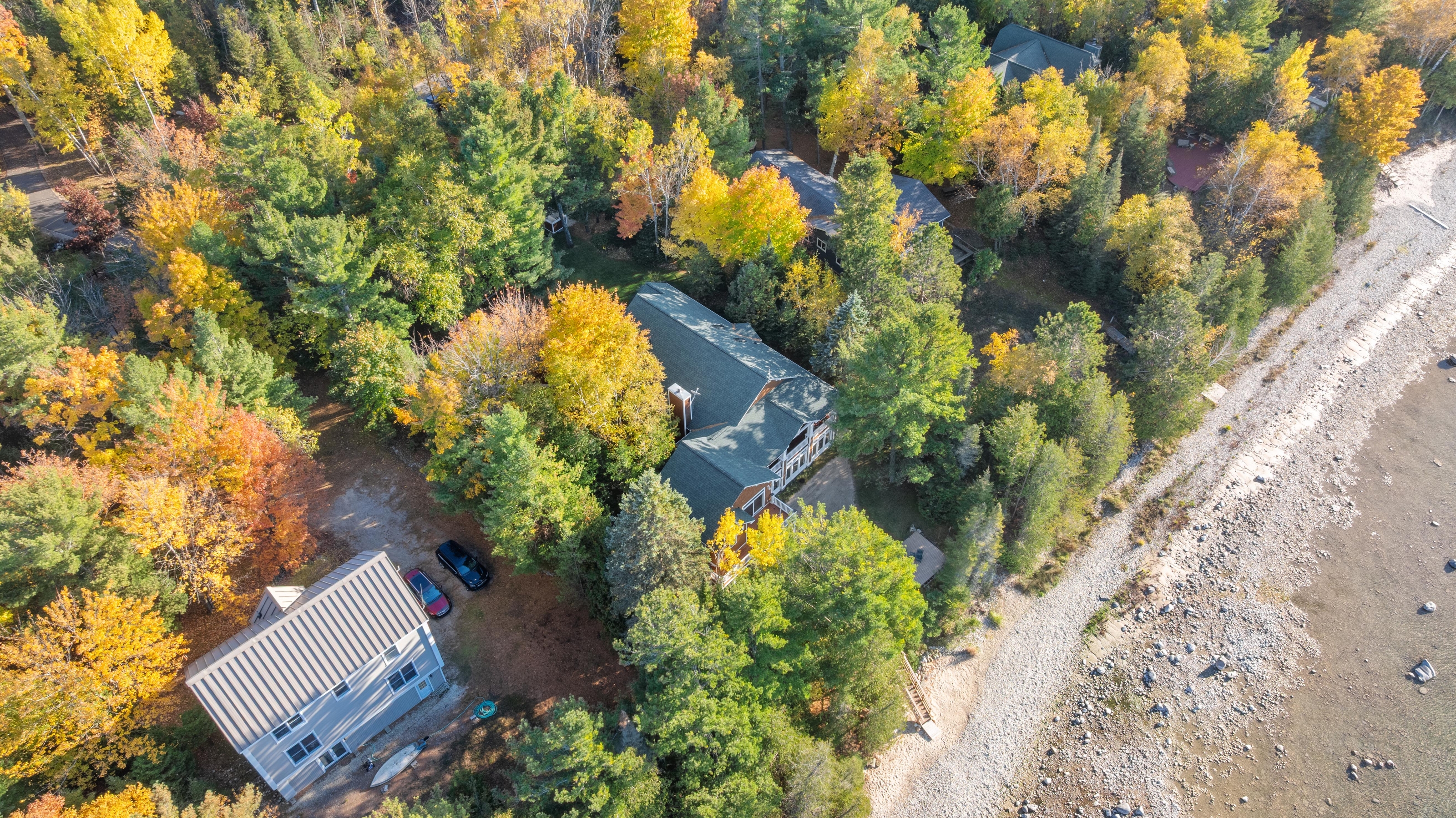 Aerial photographs of 4093 Lake Shore Drive in Charlevoix, this gem is listed at $2,099,900 through Berkshire Hathaway HomeServices Michigan Real Estate – Traverse City and The Crane Group with associate broker Johnny Crane and his brother, co-listing agent Matt Crane.