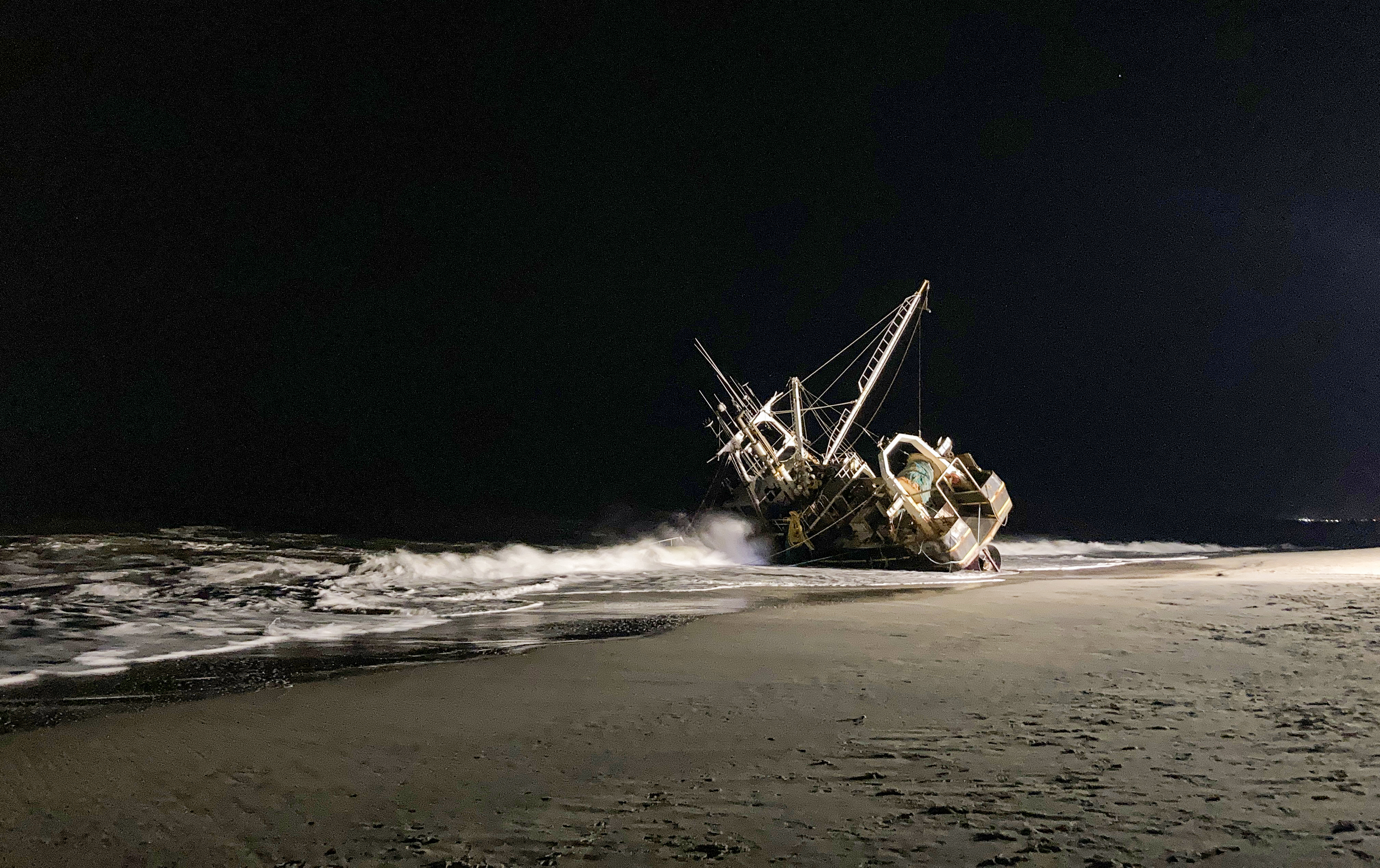 A fishing boat ran aground off New Jersey docks