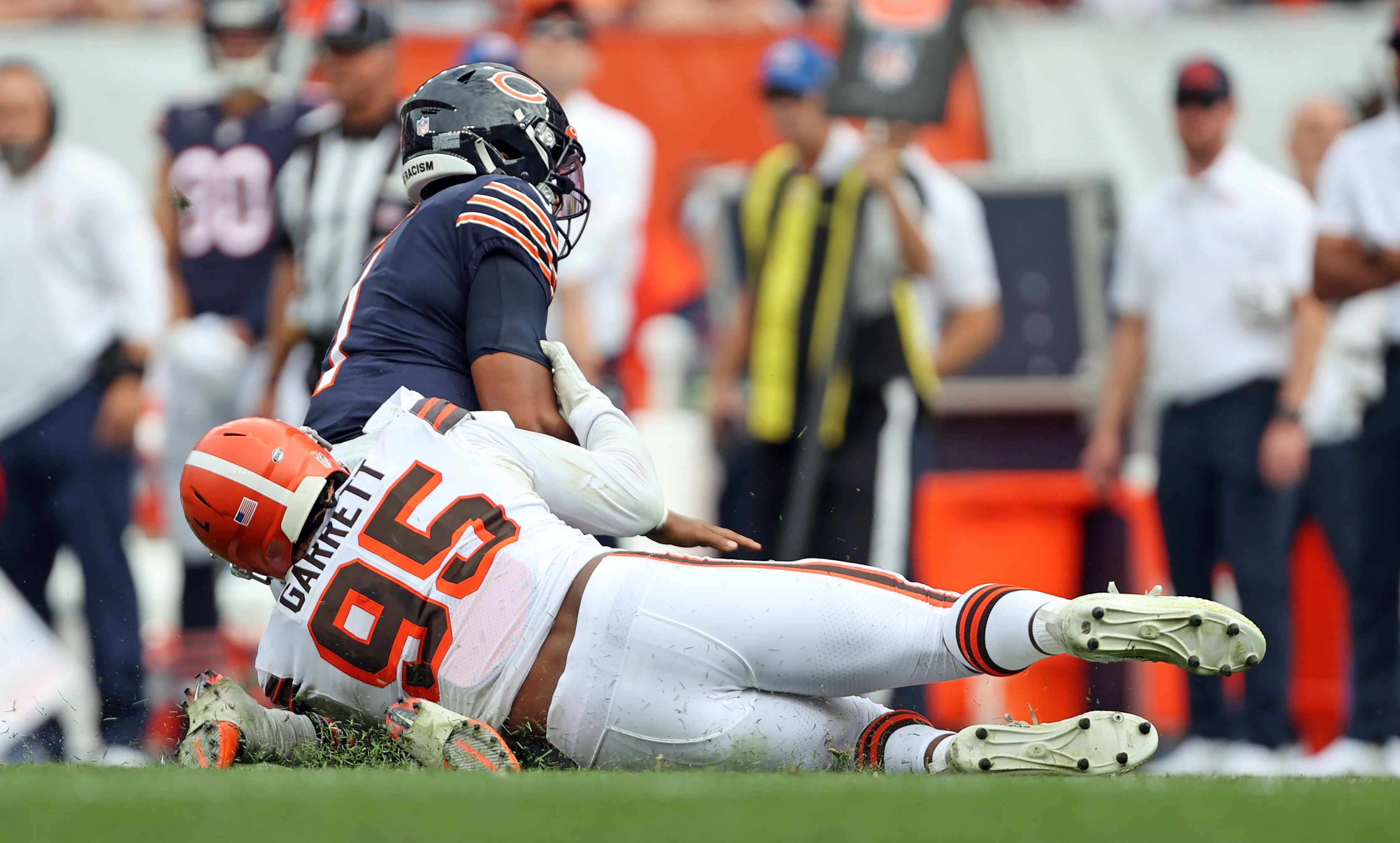 Cleveland Browns linebacker Jeremiah Owusu-Koramoah (28) and defensive end  Myles Garrett (95) celebrate during an NFL football game against the  Chicago Bears, Sunday, Sept. 26, 2021, in Cleveland. The Browns won 26-6. (