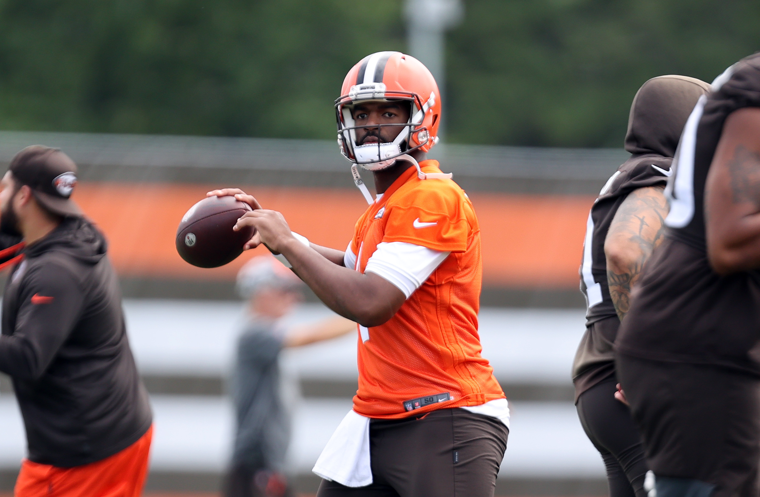 Cleveland Browns tackle James Hudson III warms-up drill during an