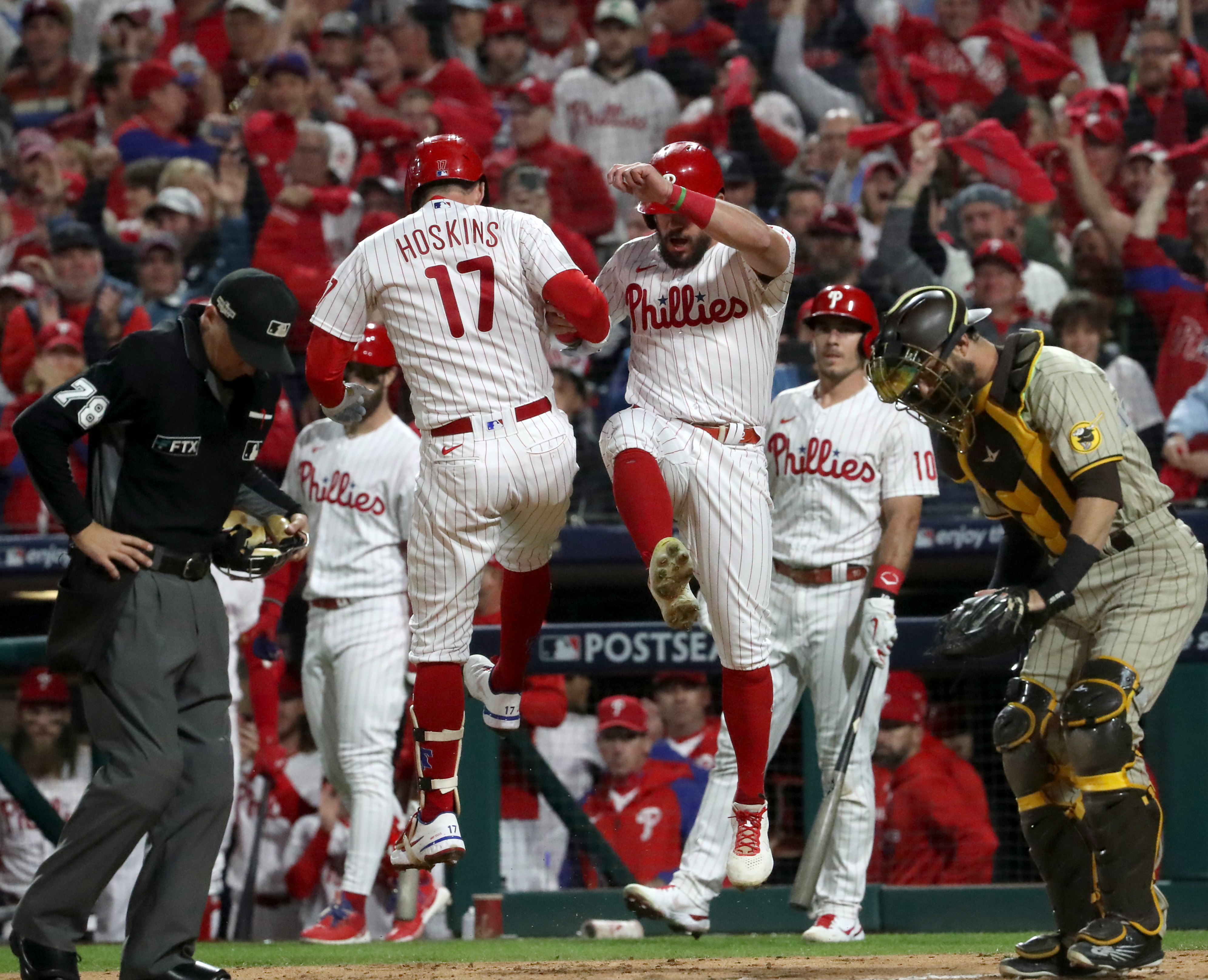 Philadelphia Phillies' Bryson Stott, right, is congratulated by Jean Segura  after hitting a home run against the San Francisco Giants during the fourth  inning of a baseball game in San Francisco, Saturday