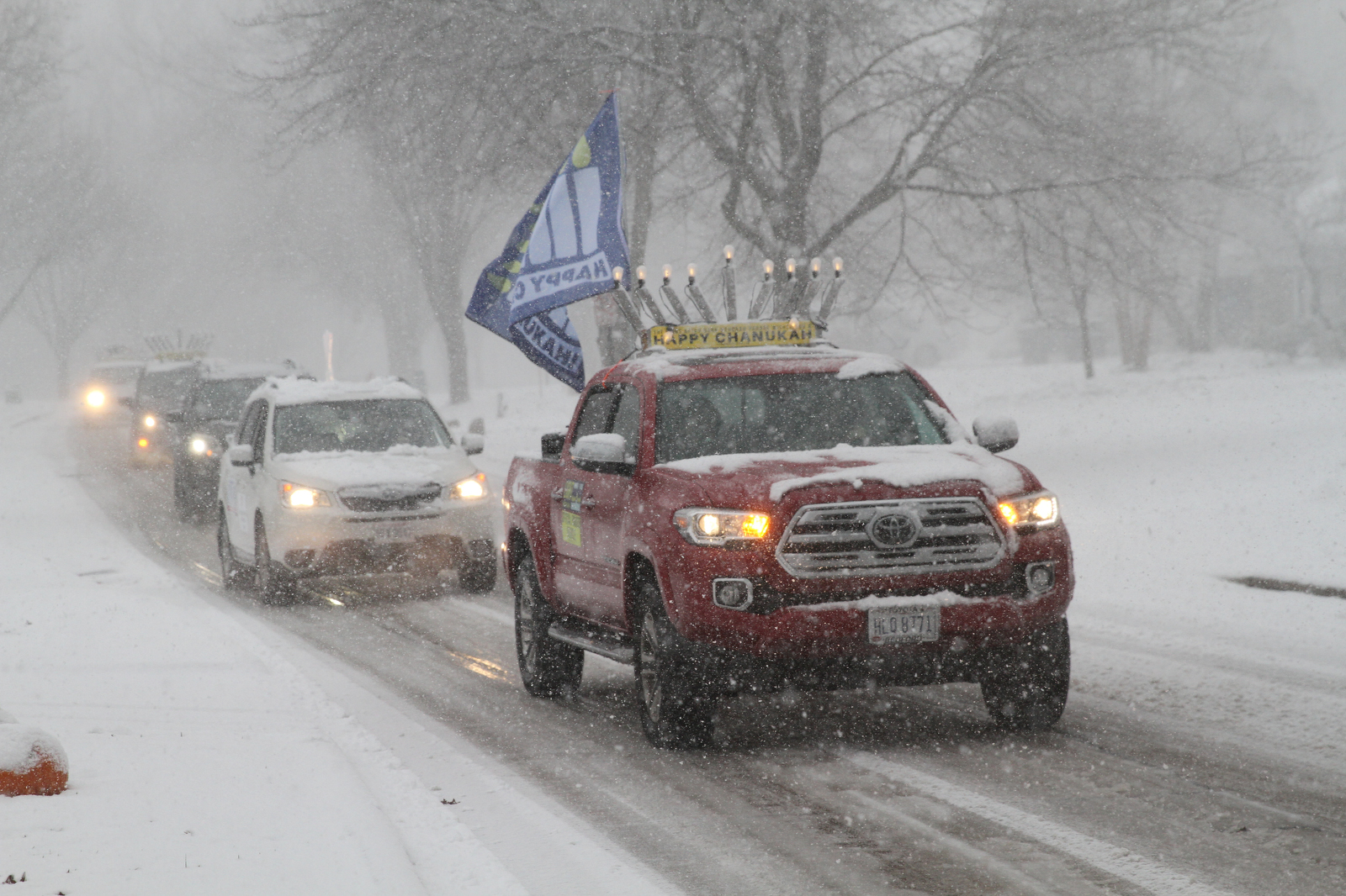 Menorahtopped cars parade through Cleveland eastern suburbs