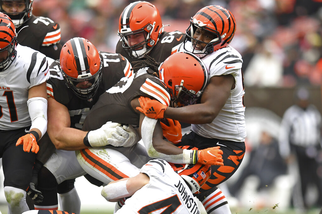 Cincinnati Bengals defensive end Noah Spence (52) runs for the play during  a preseason NFL football game against the Los Angeles Rams, Saturday, Aug.  27, 2022, in Cincinnati. (AP Photo/Emilee Chinn Stock