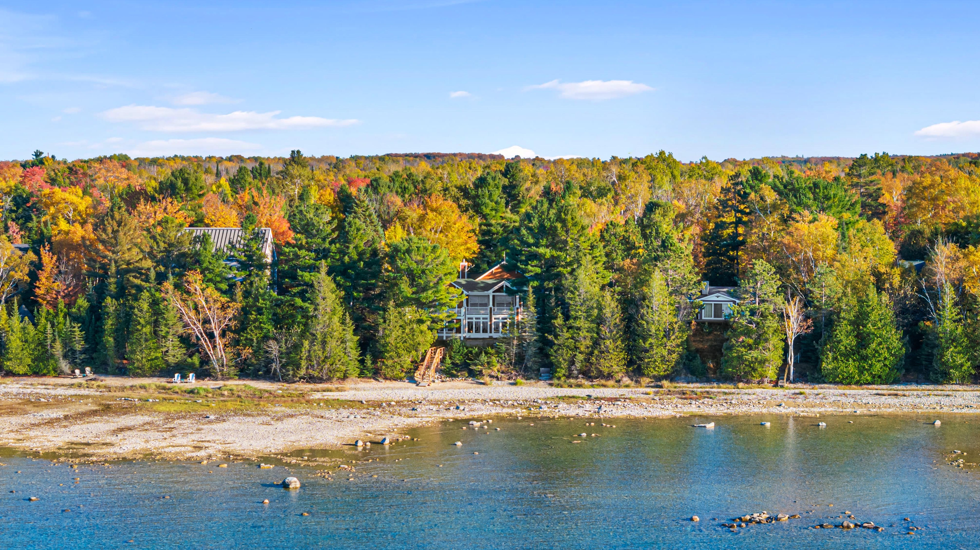 Aerial photographs of 4093 Lake Shore Drive in Charlevoix, this gem is listed at $2,099,900 through Berkshire Hathaway HomeServices Michigan Real Estate – Traverse City and The Crane Group with associate broker Johnny Crane and his brother, co-listing agent Matt Crane.