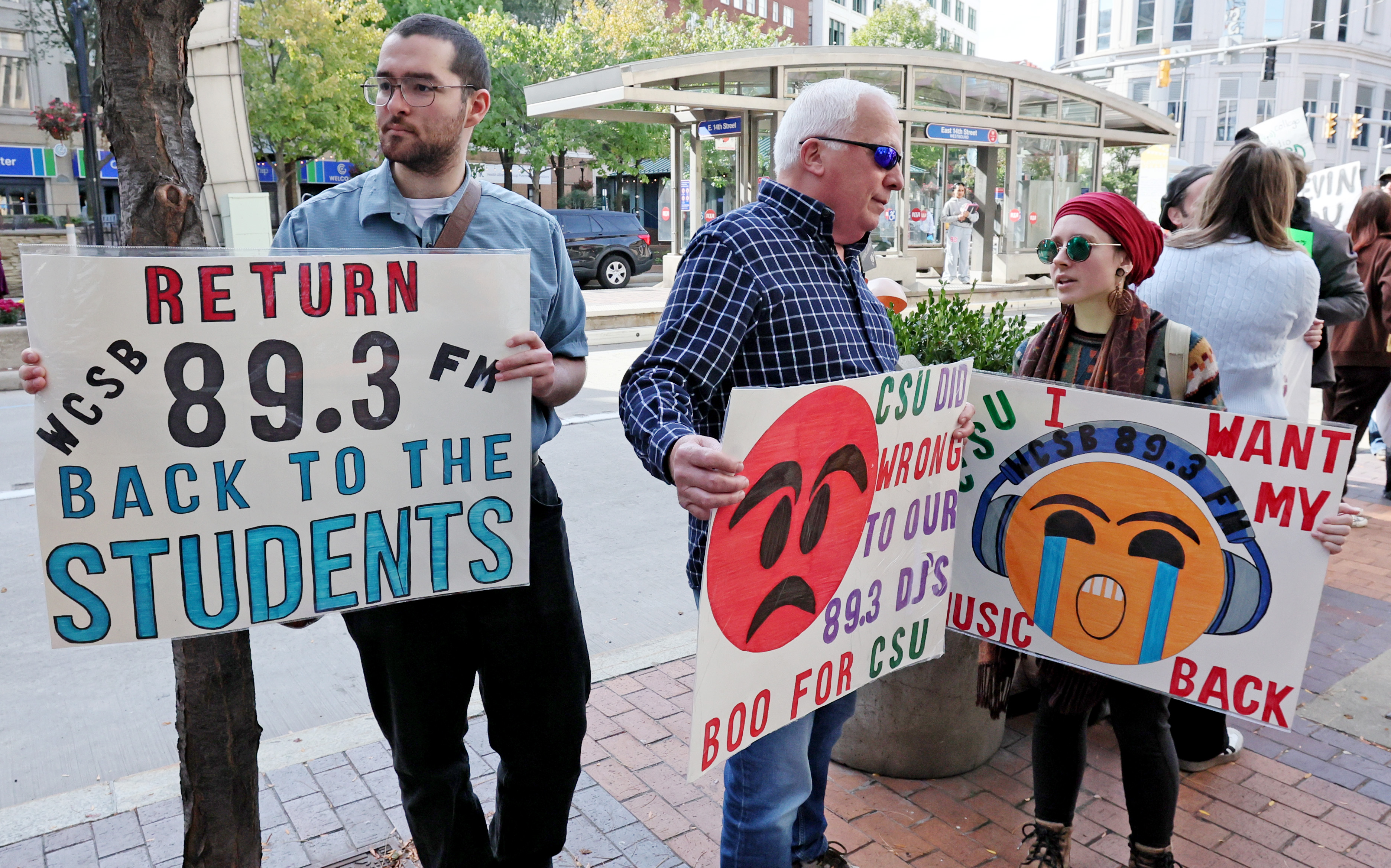 Protestors rally outside Cleveland’s City Club during lunch forum with ...