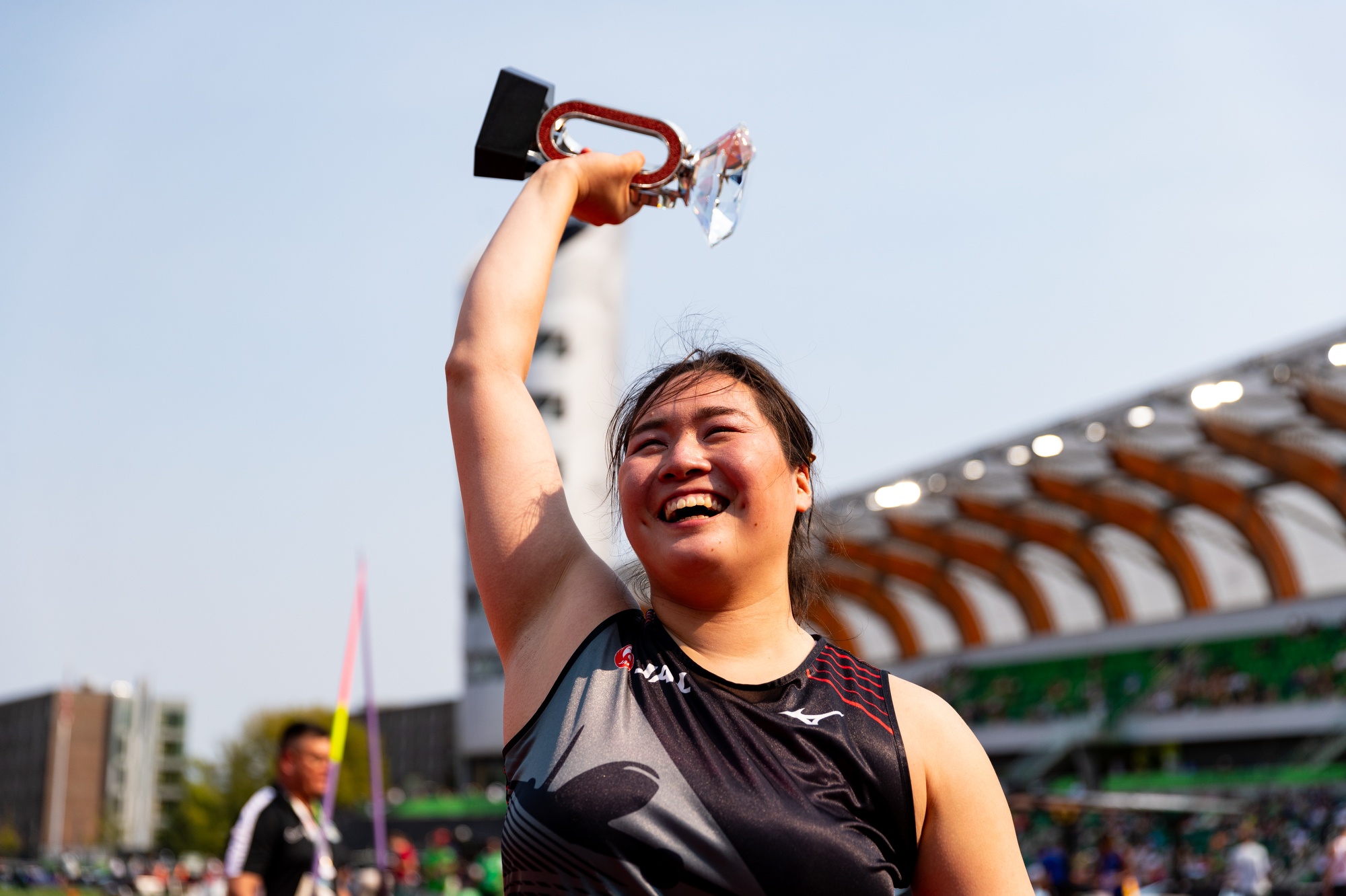 Japan's Haruka Kitaguchi celebrates with the Diamond League trophy after winning the women's javelin during the Prefontaine Classic track and field meet on Saturday, Sept. 16, 2023, at Hayward Field in Eugene.