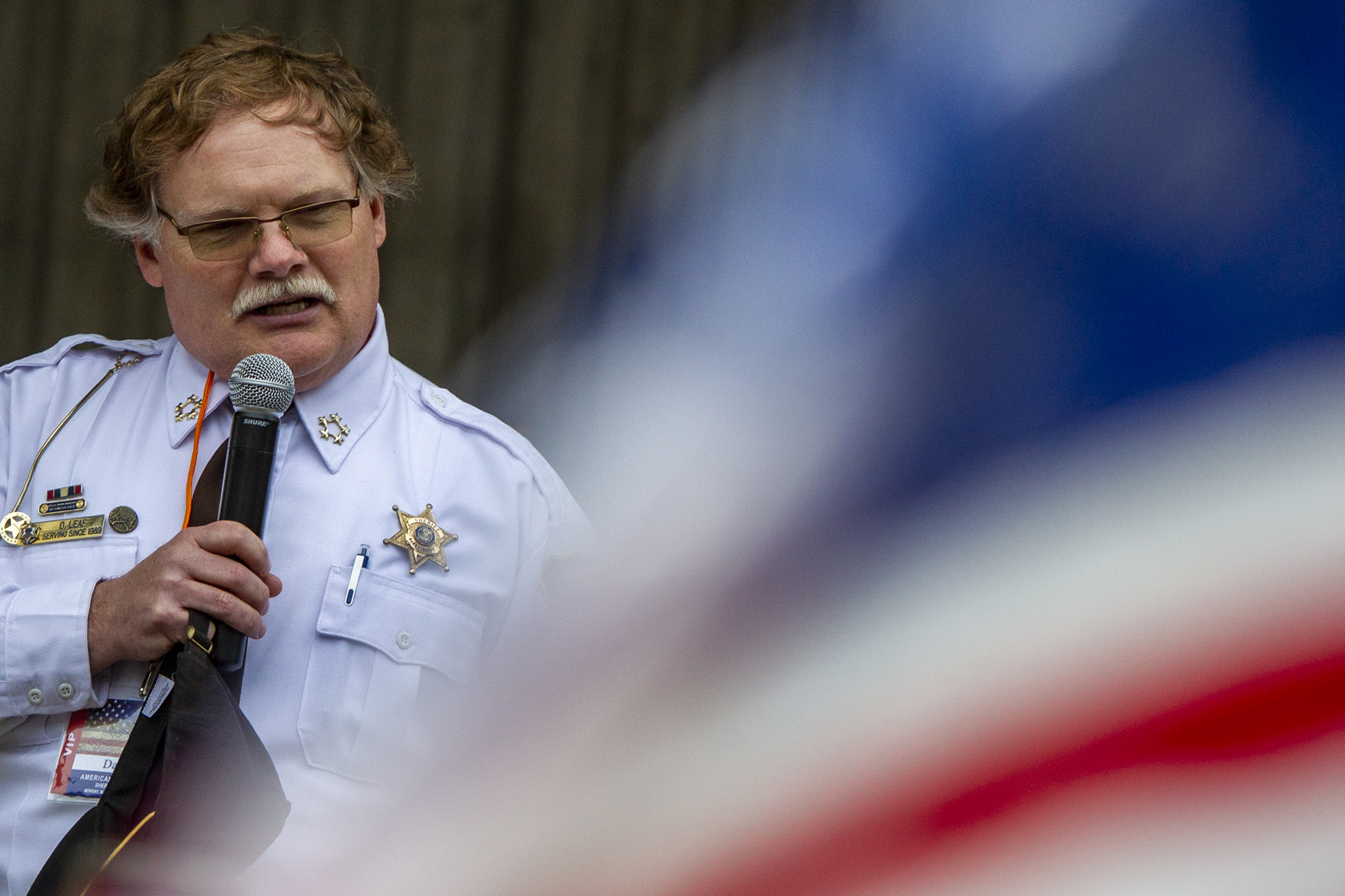 Barry County Sheriff Dar Leaf speaks during the "American Patriot Rally-Sheriffs speak out" event at Rosa Parks Circle in downtown Grand Rapids on Monday, May 18, 2020. The crowd is protesting against Gov. Gretchen Whitmer's stay-at-home order. (Cory Morse | MLive.com)